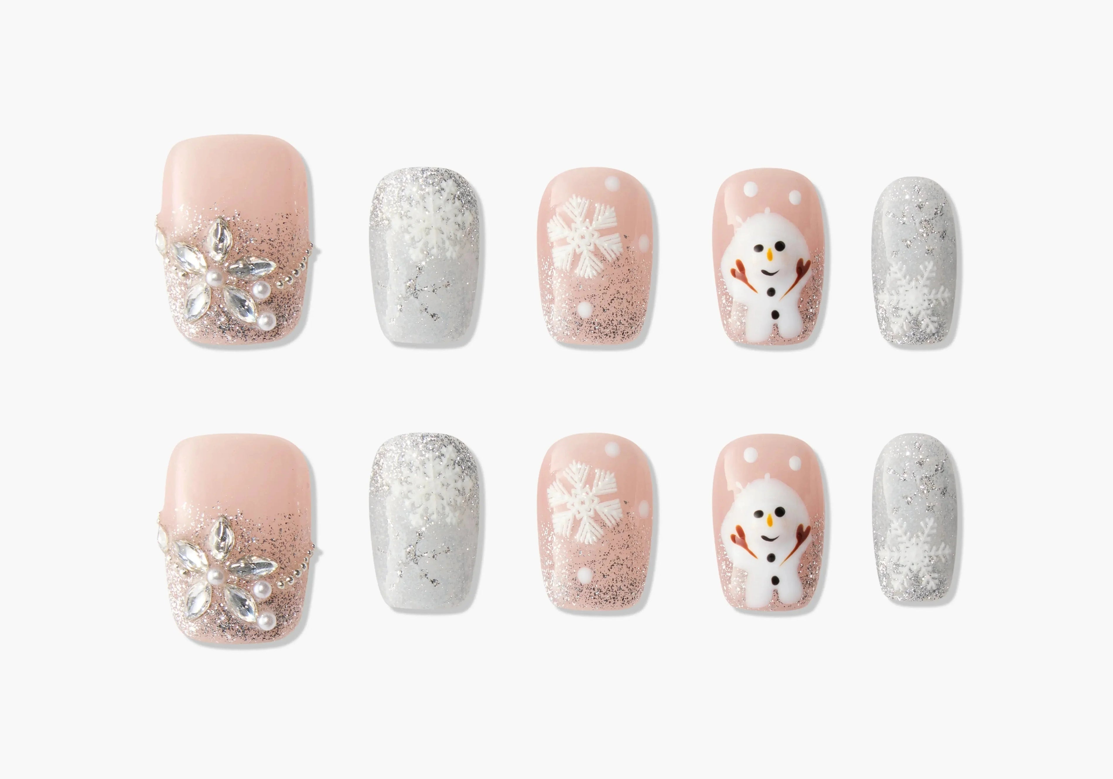 Set of 10 winter-themed press-on nails with snowflakes, snowman, glitter, and rhinestone designs