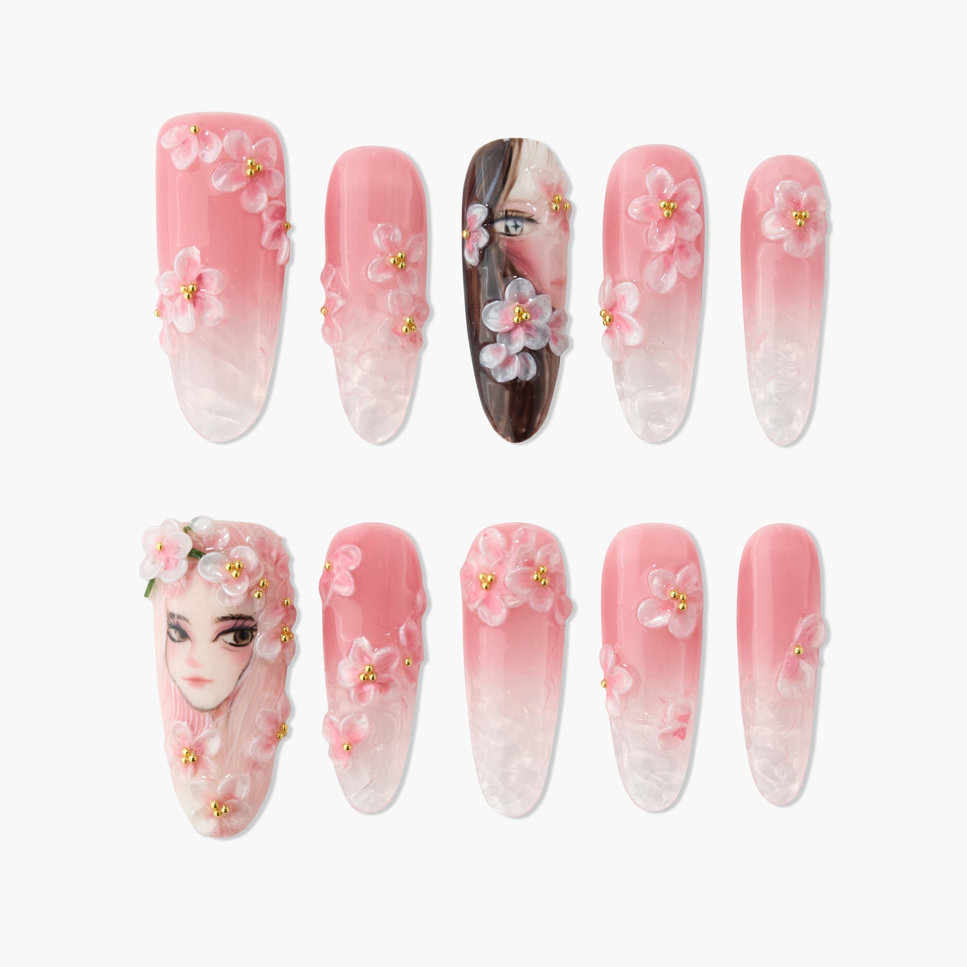Set of pink and white ombre press-on nails with 3D floral designs and hand-painted female faces