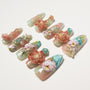 Set of intricately designed false nails with floral and bird 3D art in soft pastel colors