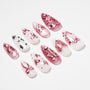 Handmade press-on nails with pink glitter, butterfly designs, and rhinestone accents