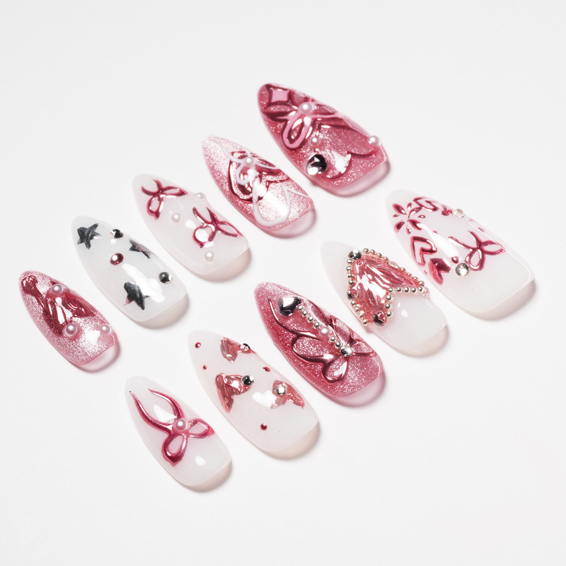 Handmade press-on nails with pink glitter, butterfly designs, and rhinestone accents