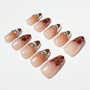 Handmade press-on nails with nude gradient, silver pearl accents, and brown marble tips