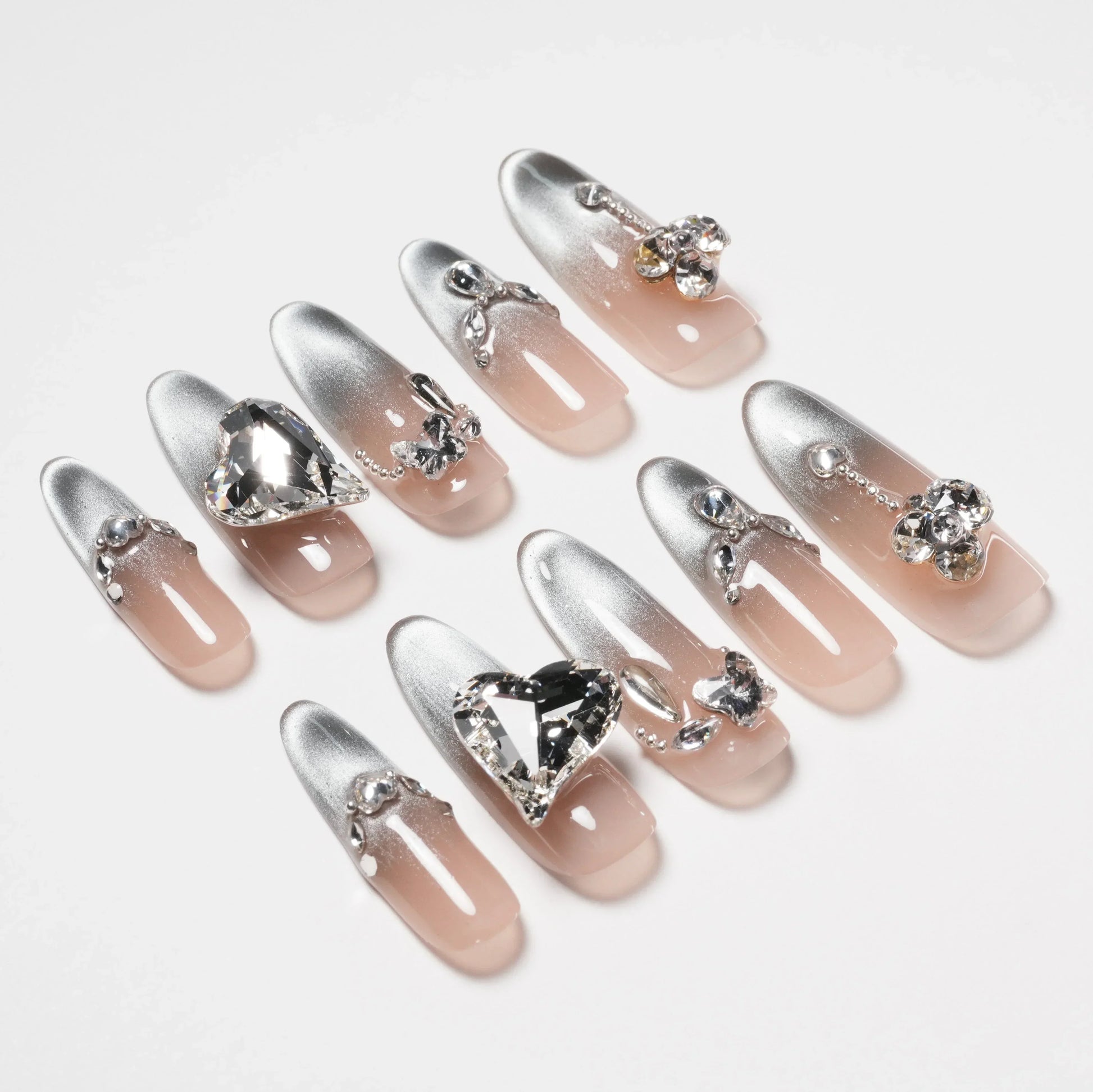 Set of silver ombre press-on nails with 3D rhinestones and heart-shaped crystal accents