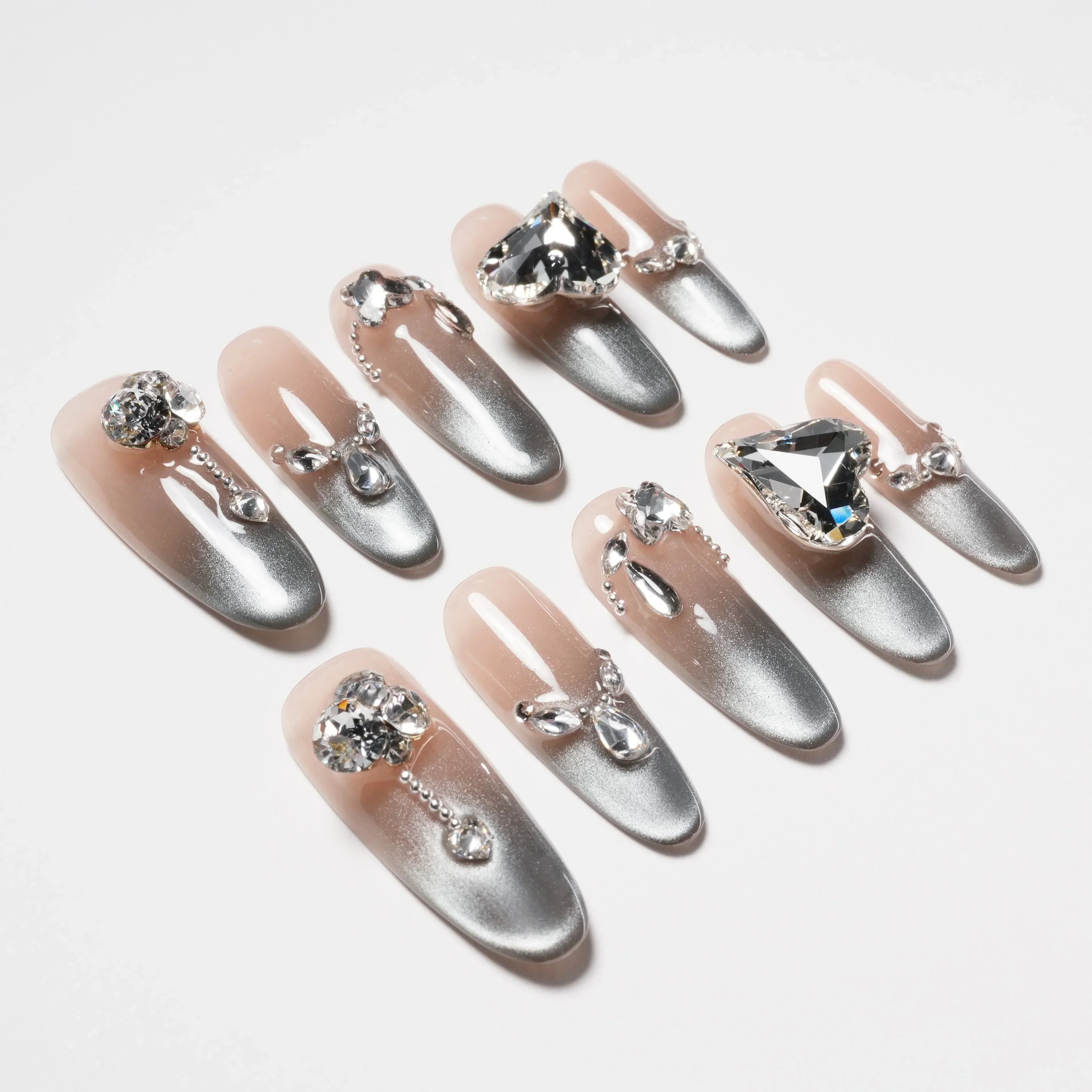 Set of silver gradient false nails with large rhinestone and gem nail art decorations