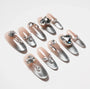 Set of silver gradient false nails with large rhinestone and gem nail art decorations