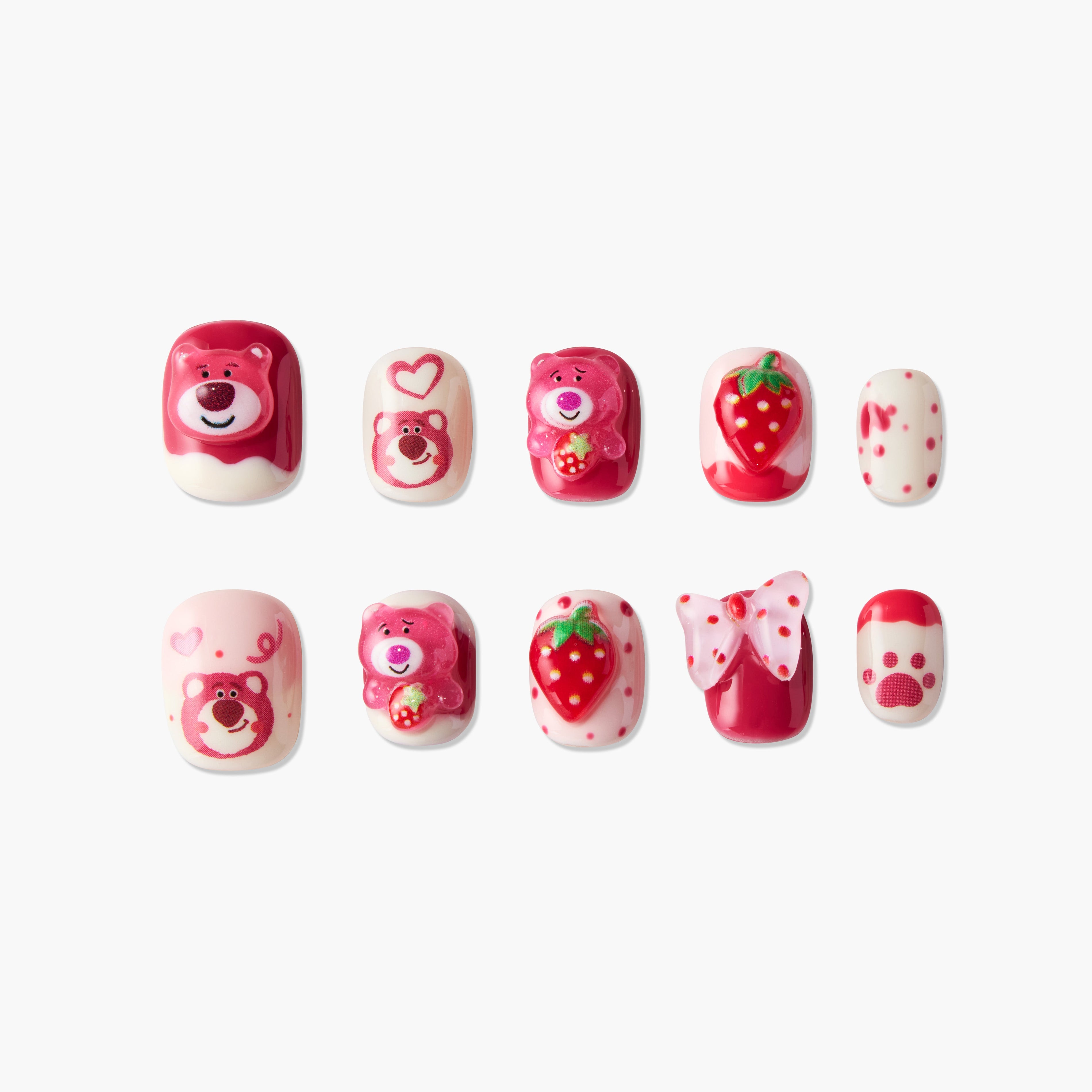 Cute pink and red fake nails with teddy bear, strawberry, bow, and paw print designs