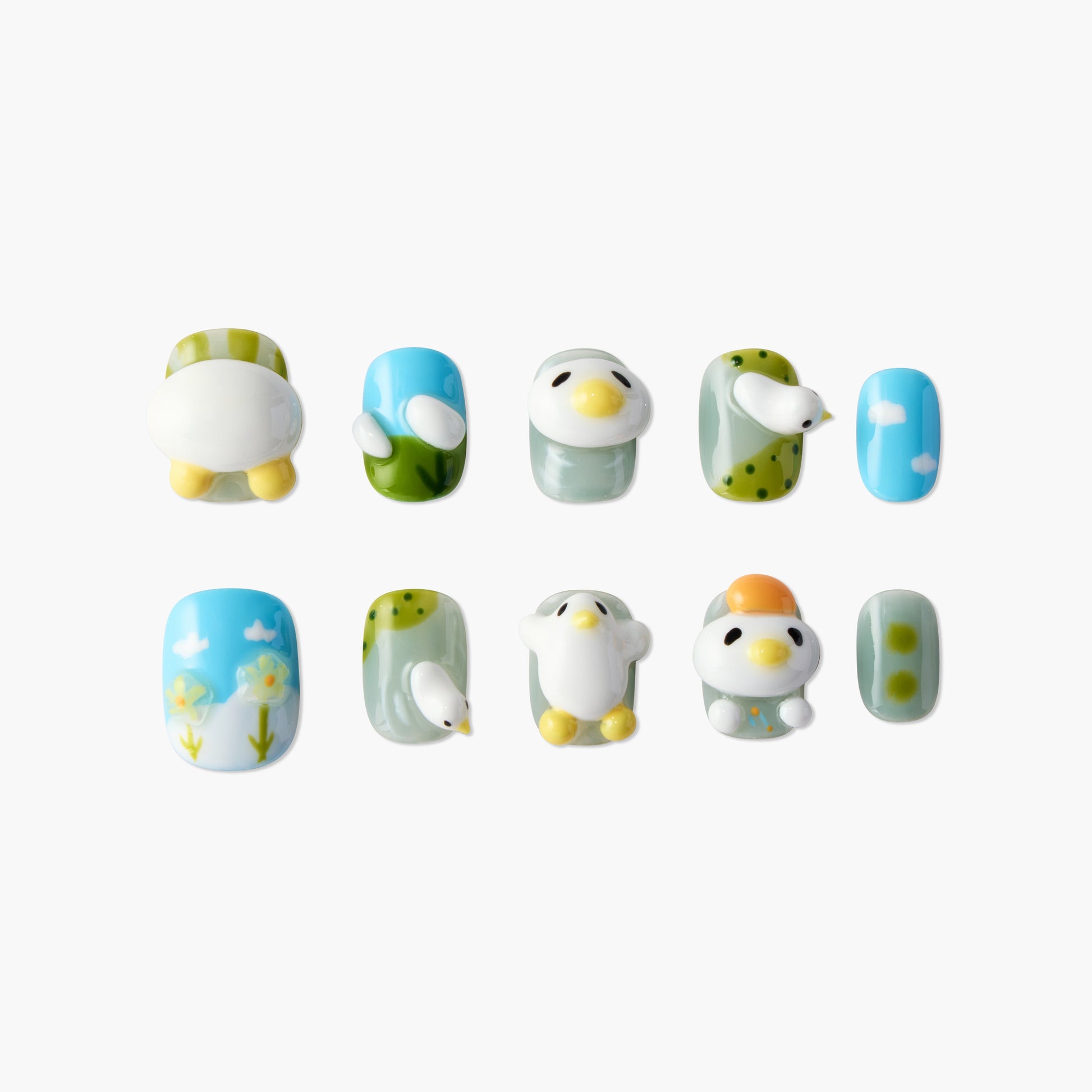 Handmade press-on nails with 3D bird designs, nature patterns, and pastel colors