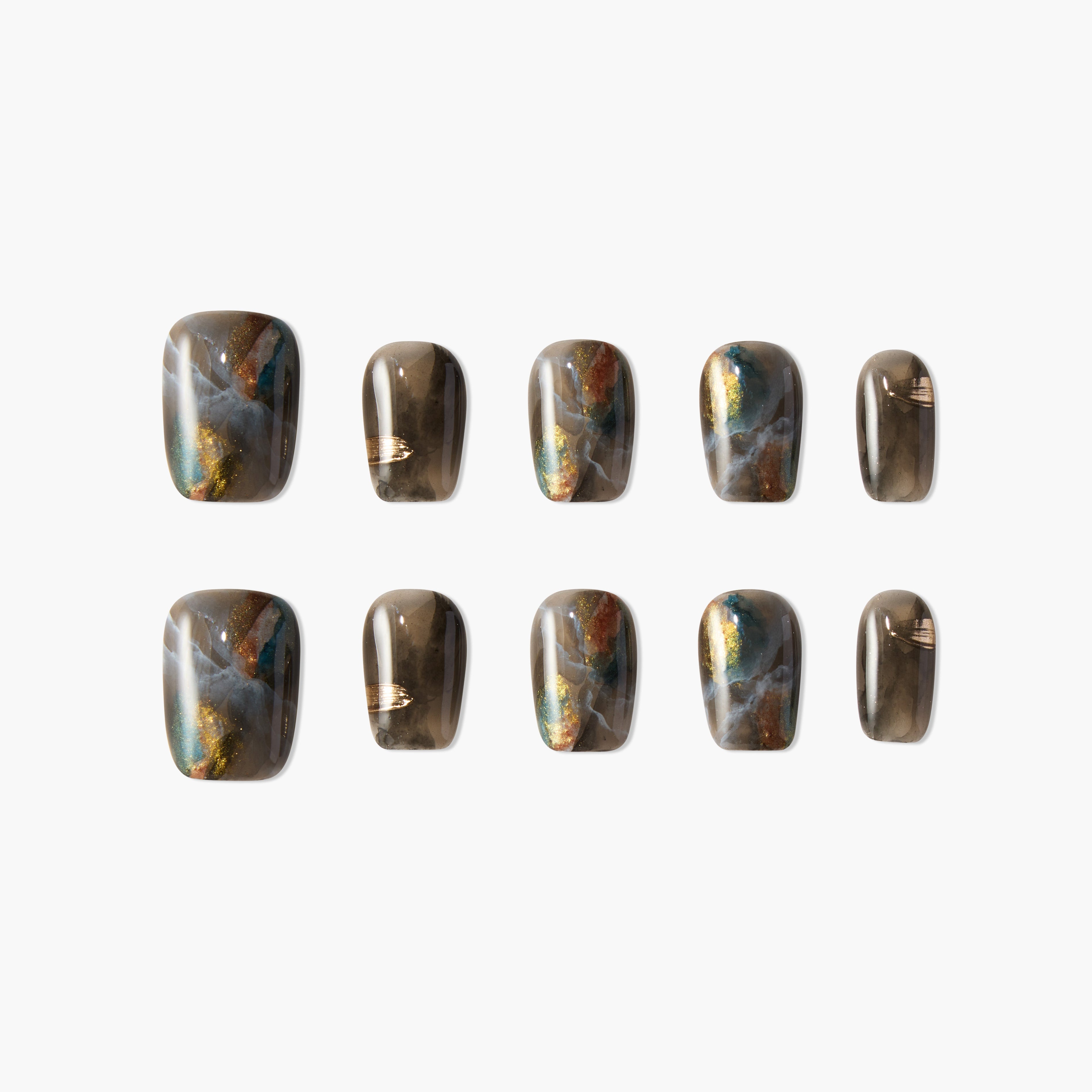 Set of brown and gold marbled press-on nails with blue and white accents on white background