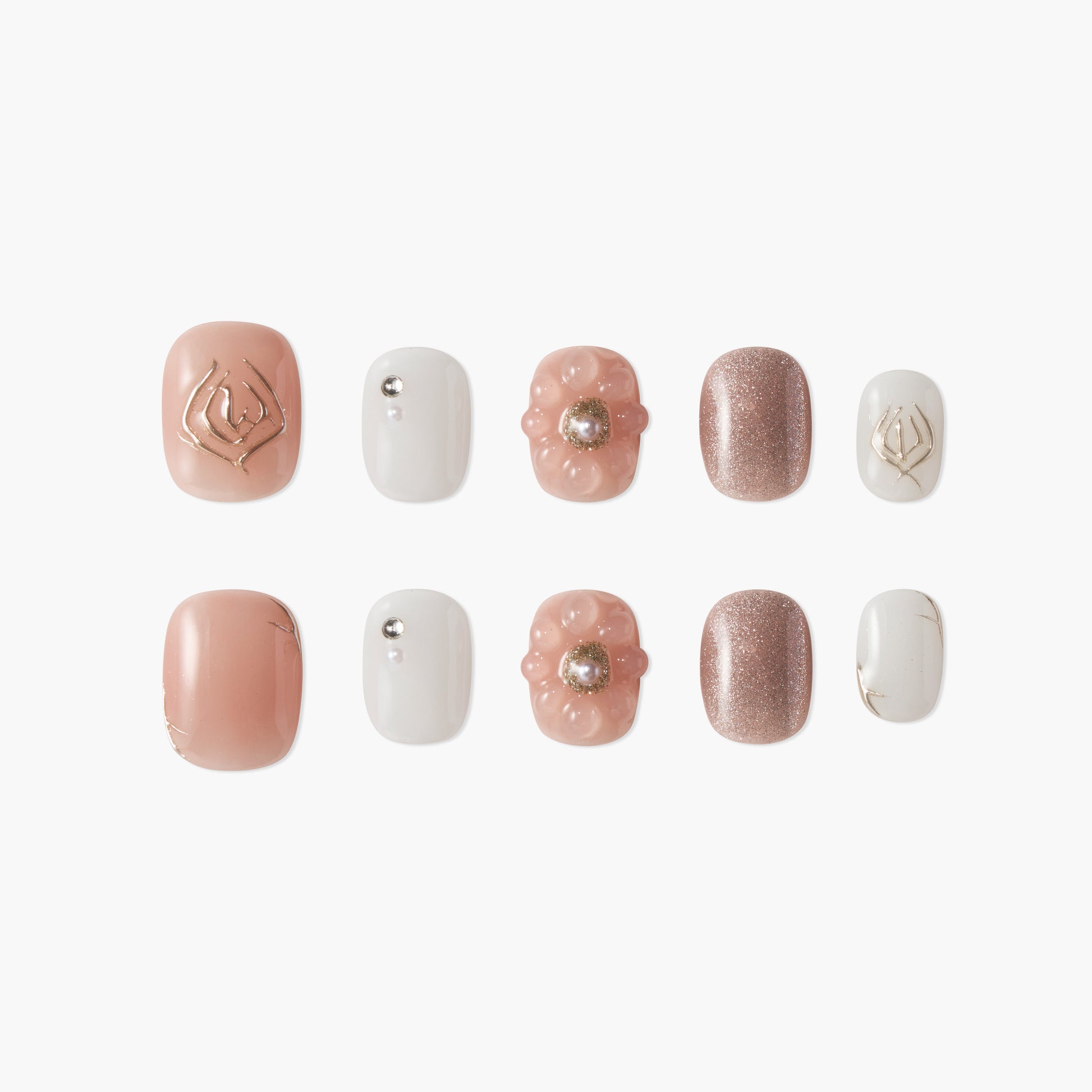 Handmade press-on nails in blush pink, white, and glitter, with floral and pearl accents.