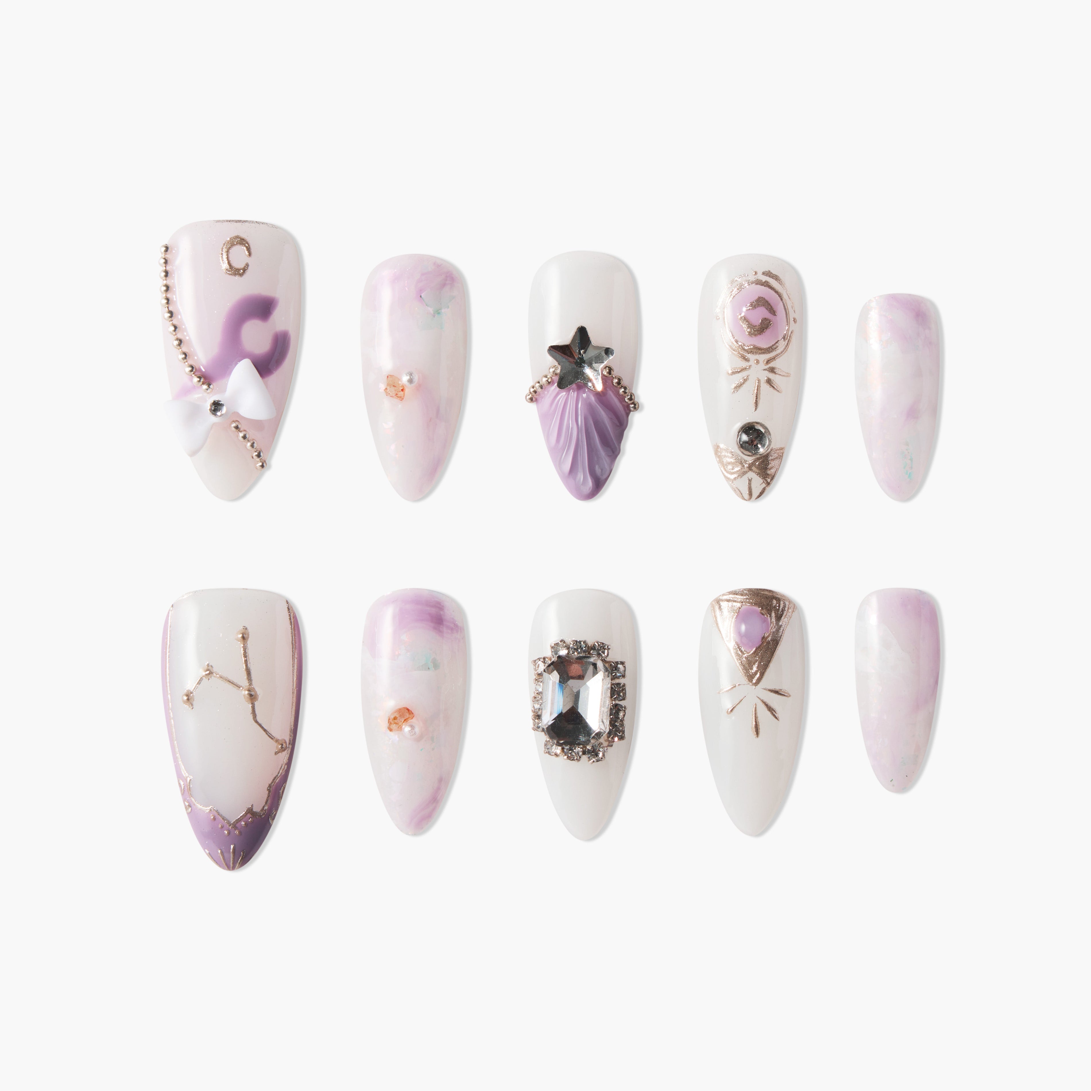Set of twelve purple and white acrylic false nails with star, gemstone, bow, and constellation designs on white background