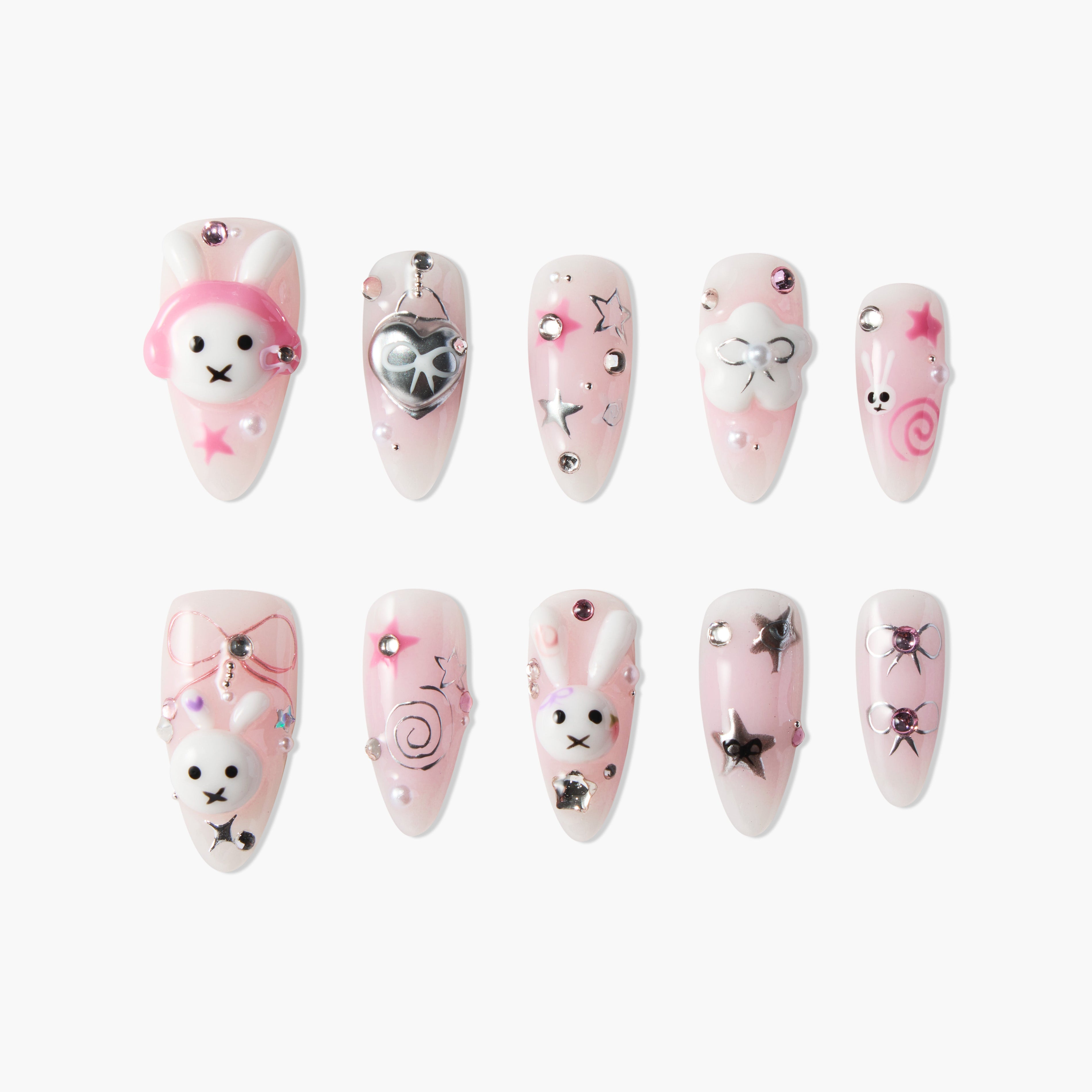 Set of pink and white false nails with 3D bunny, heart, star, bow, and swirl nail art designs