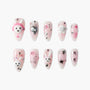 Handmade pink press-on nails with 3D bunny, stars, bows, and rhinestone designs