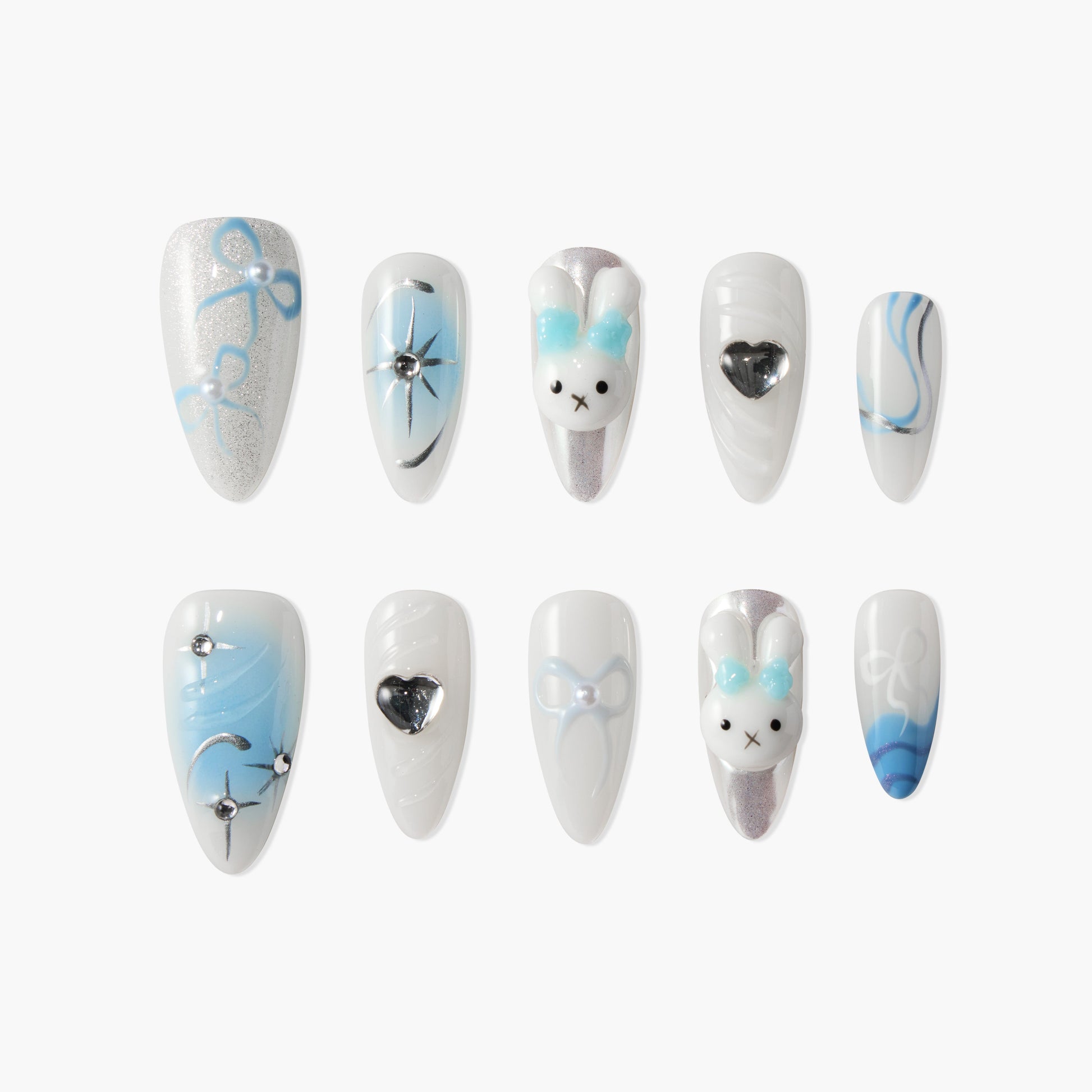 Handmade press-on nails with blue and white designs, bows, hearts, and 3D bunny art.