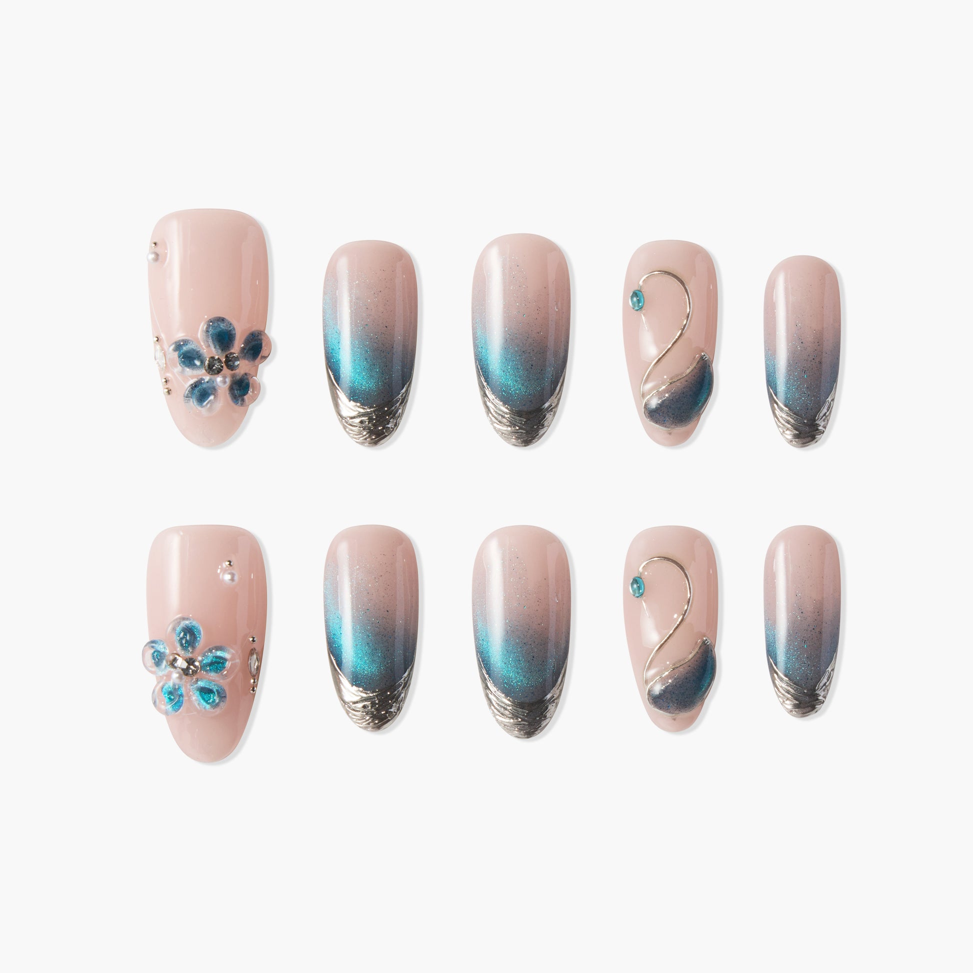 Set of pink and blue ombré press-on nails with floral and swan designs and jewel accents
