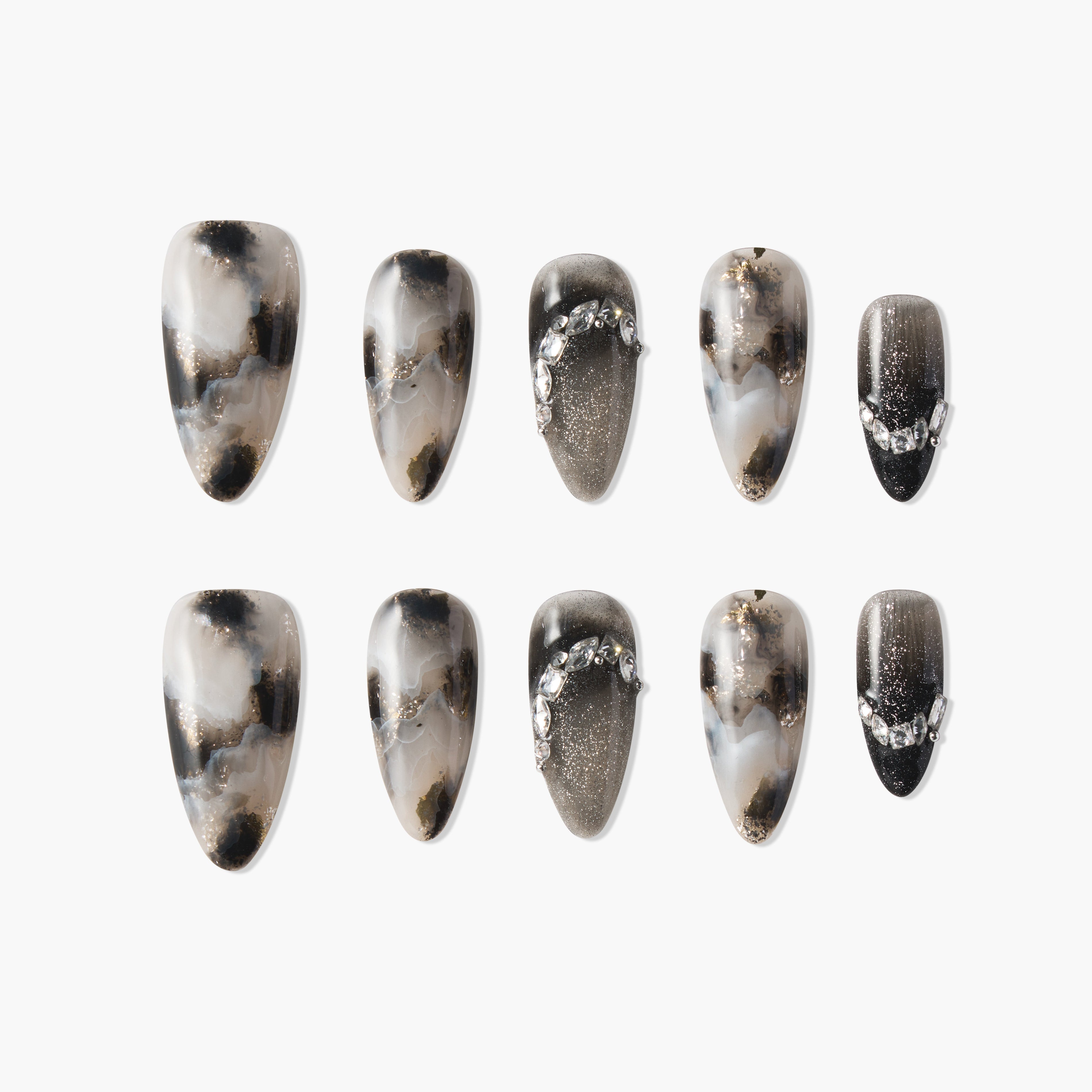 Set of black and white marble-effect press-on nails with glitter and rhinestone accents