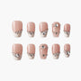 Nude and white French press-on nails with rhinestone and crystal gem accents