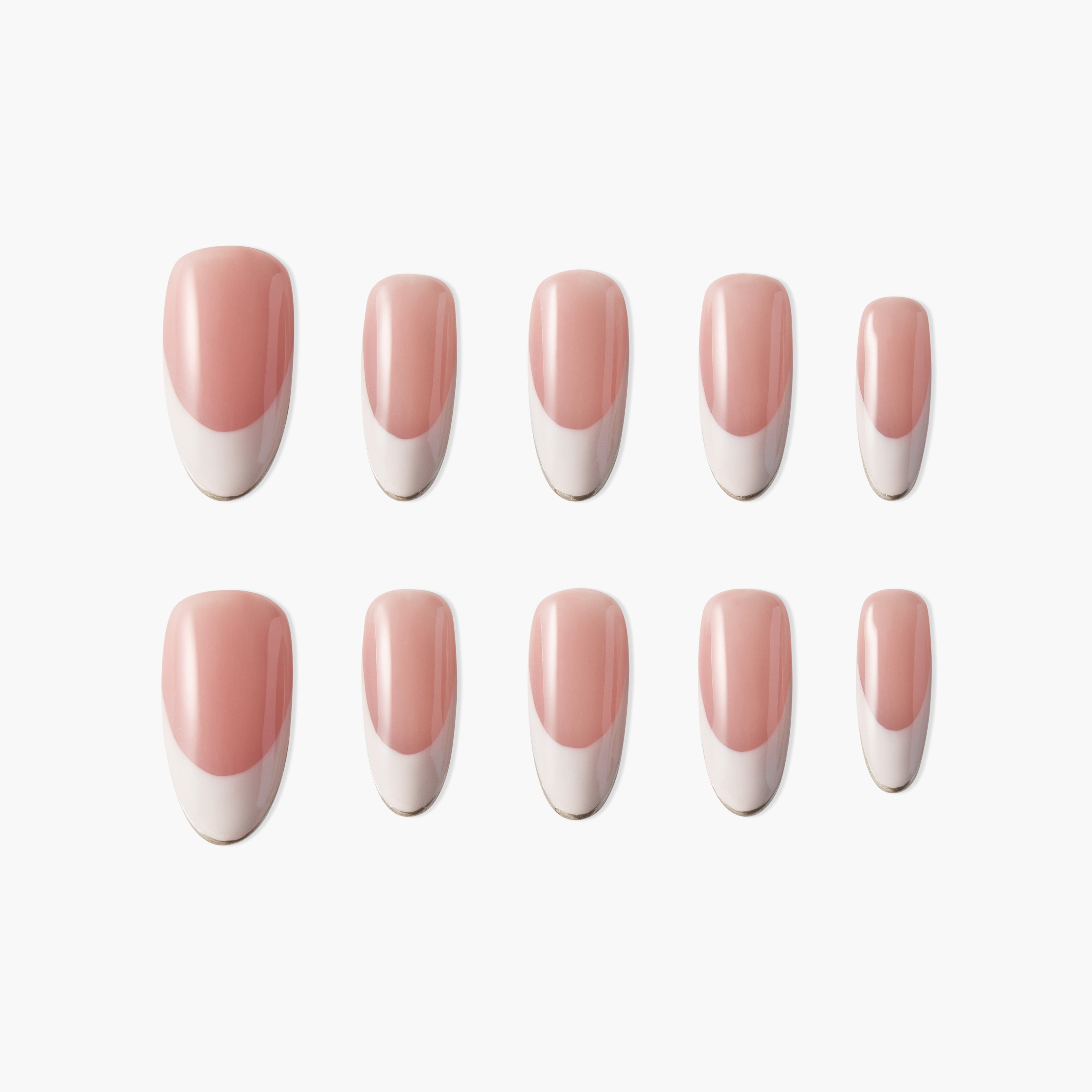 Set of pink and white French manicure press-on nails in two rows on white background