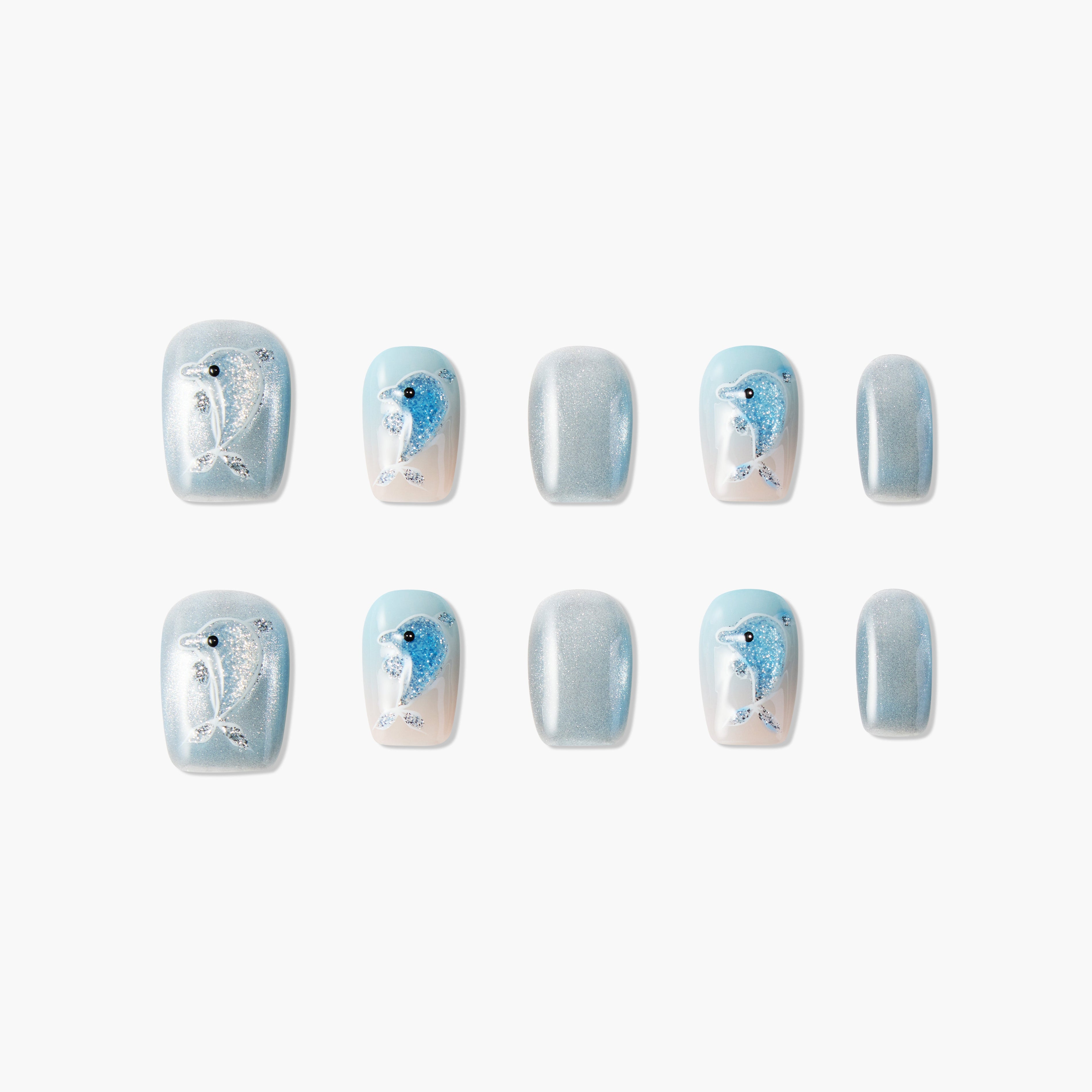 Set of blue and silver glitter press-on nails with dolphin designs on white background