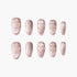 Set of shimmery pink press-on nails with embossed heart designs on white background