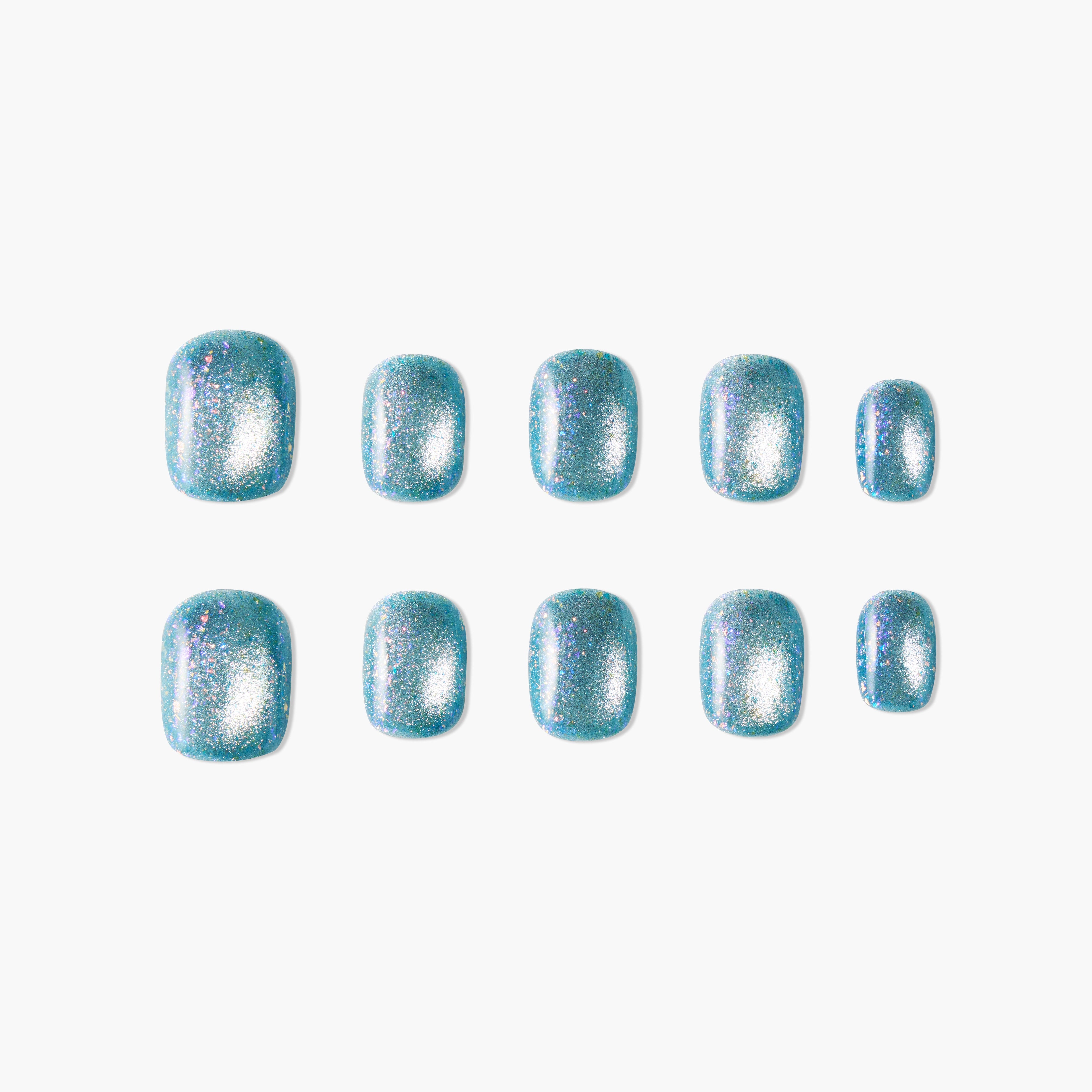 Set of blue glittery press-on nails with a shiny, sparkly finish arranged on white background