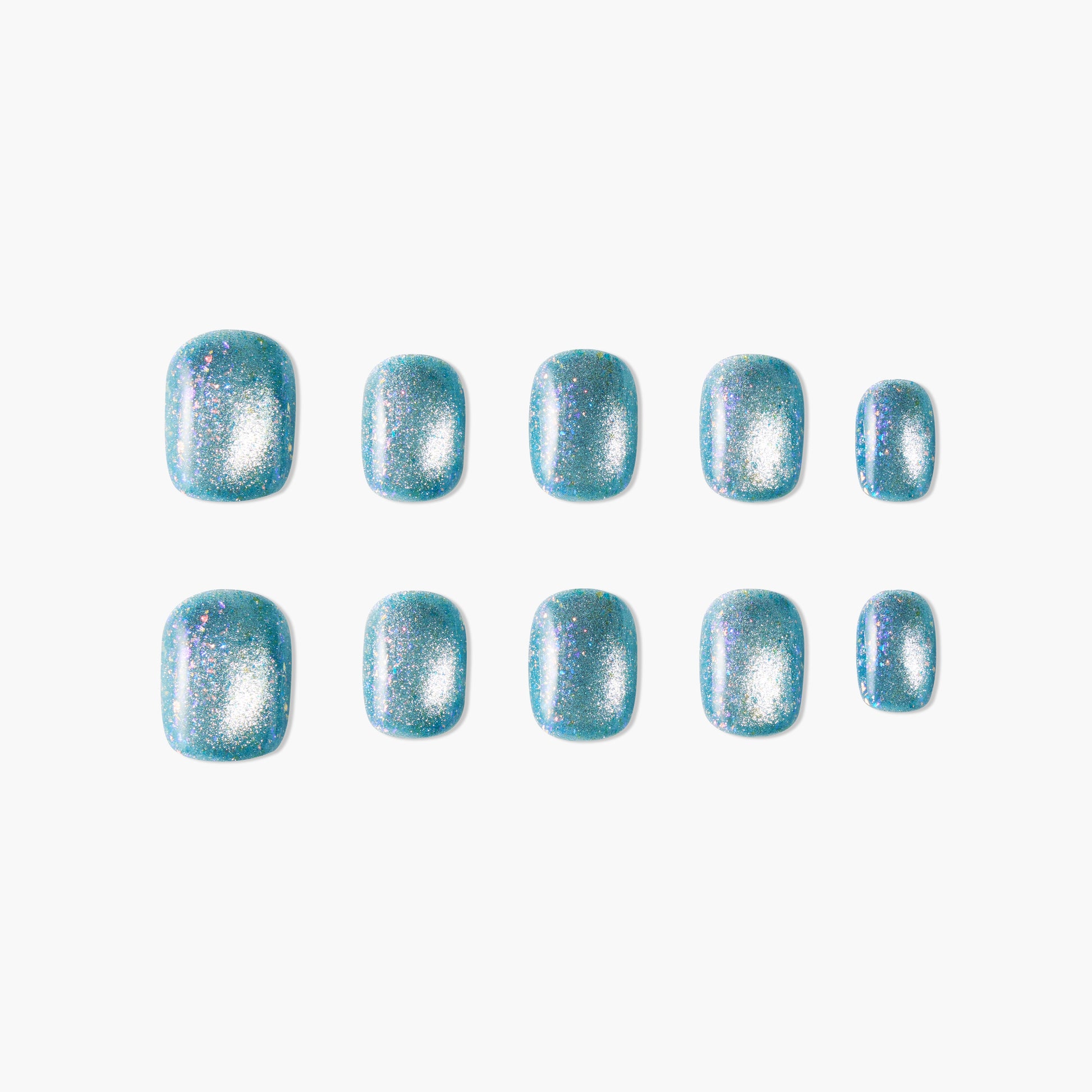 Set of blue glittery press-on nails with a shiny, sparkly finish arranged on white background