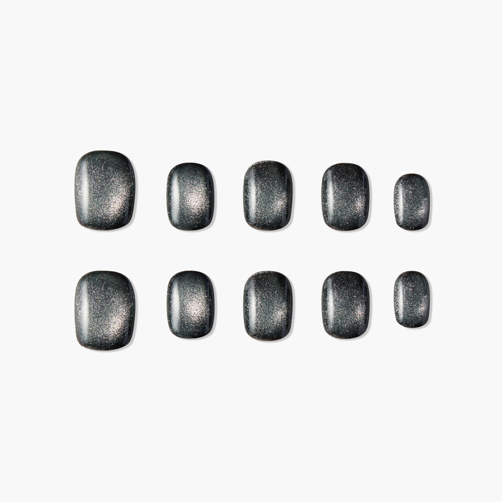 Set of matte black press-on nails with silver shimmer, arranged on a white background
