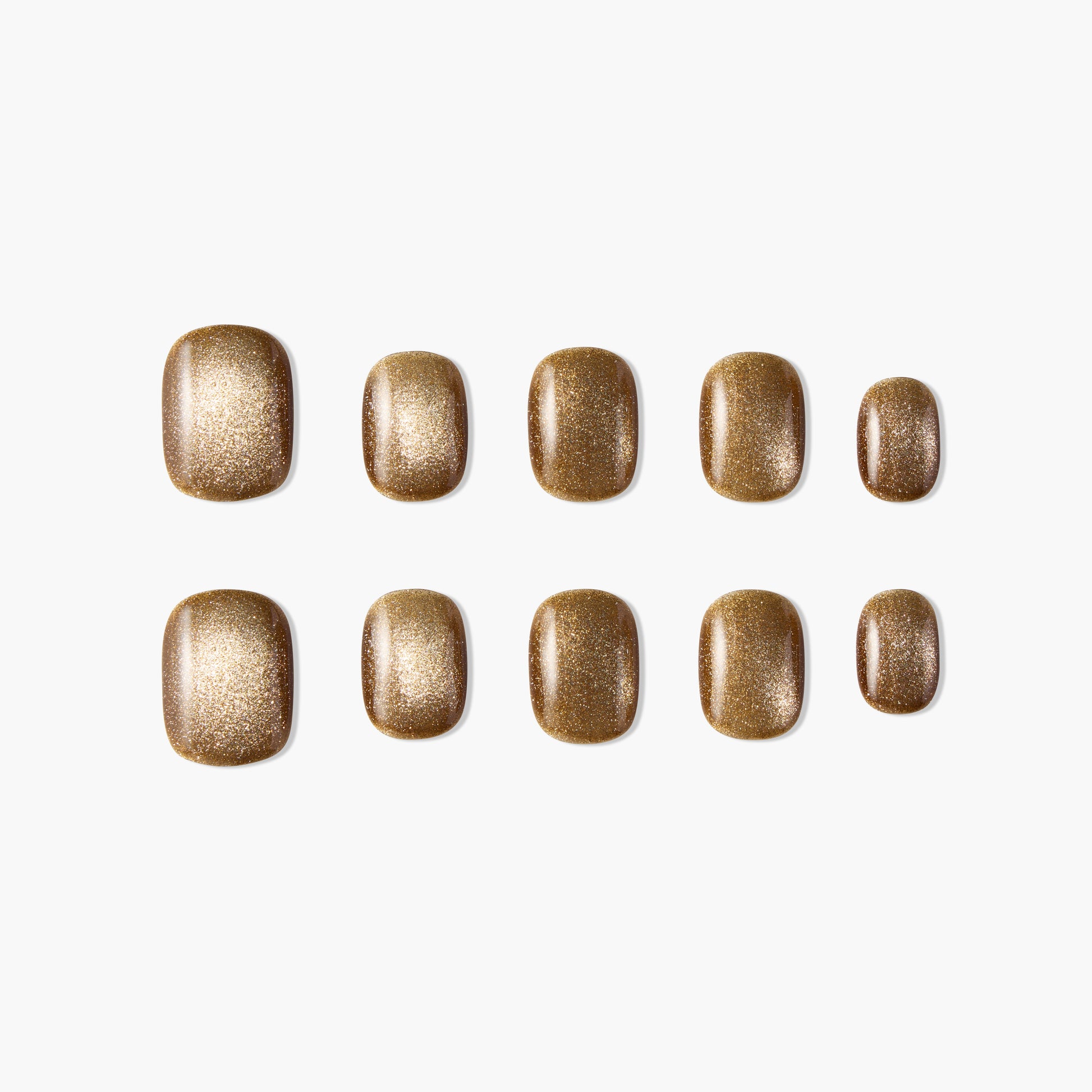 Set of gold glitter press-on nails, oval shape, displayed on a white background.