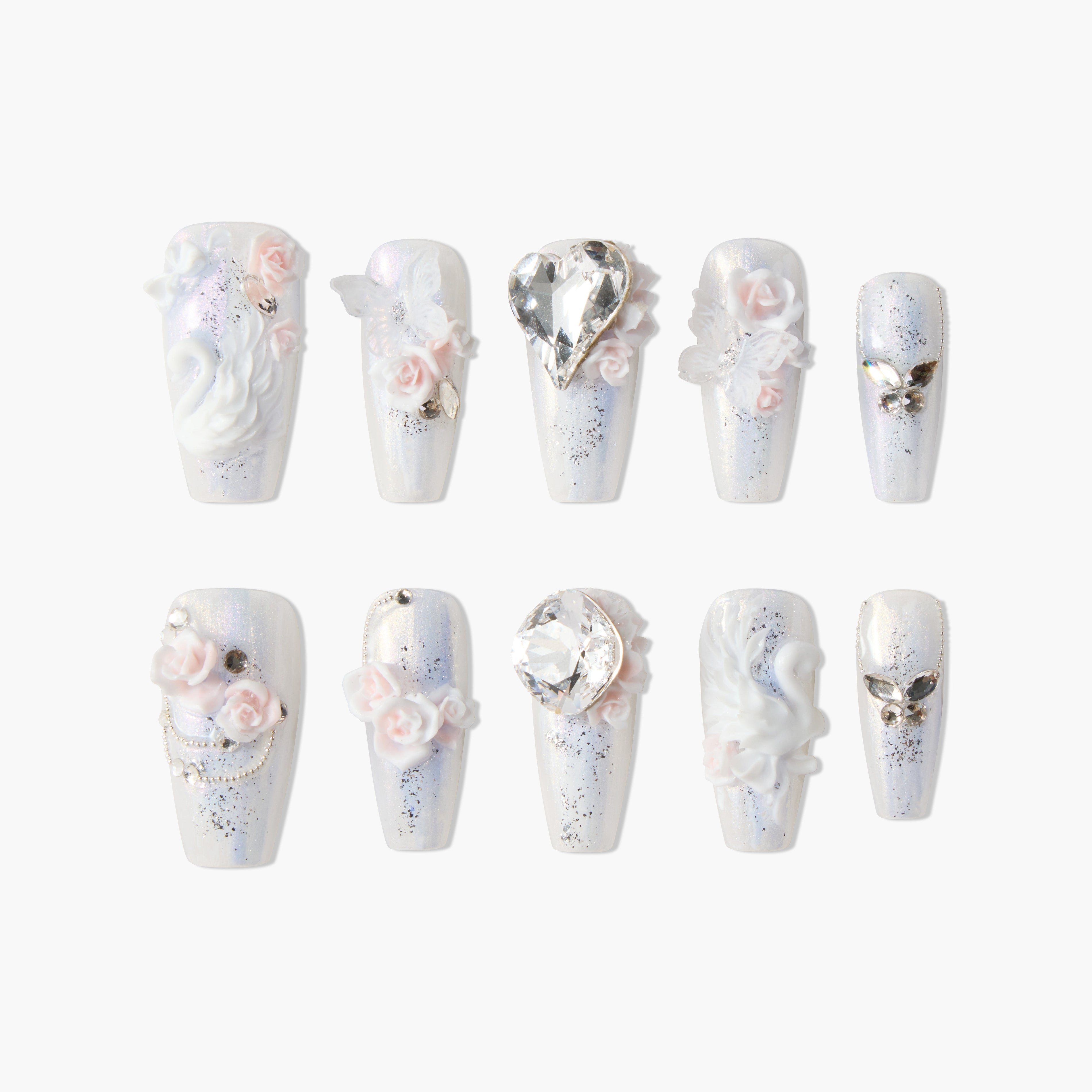 Set of pearl white nails with 3D swan, heart crystal, pink roses, butterflies, and silver gems