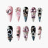 Set of ten ornate stiletto false nails with pink, black, and silver bases, decorated with pearls, rhinestones, hearts, stars, bows, and crosses