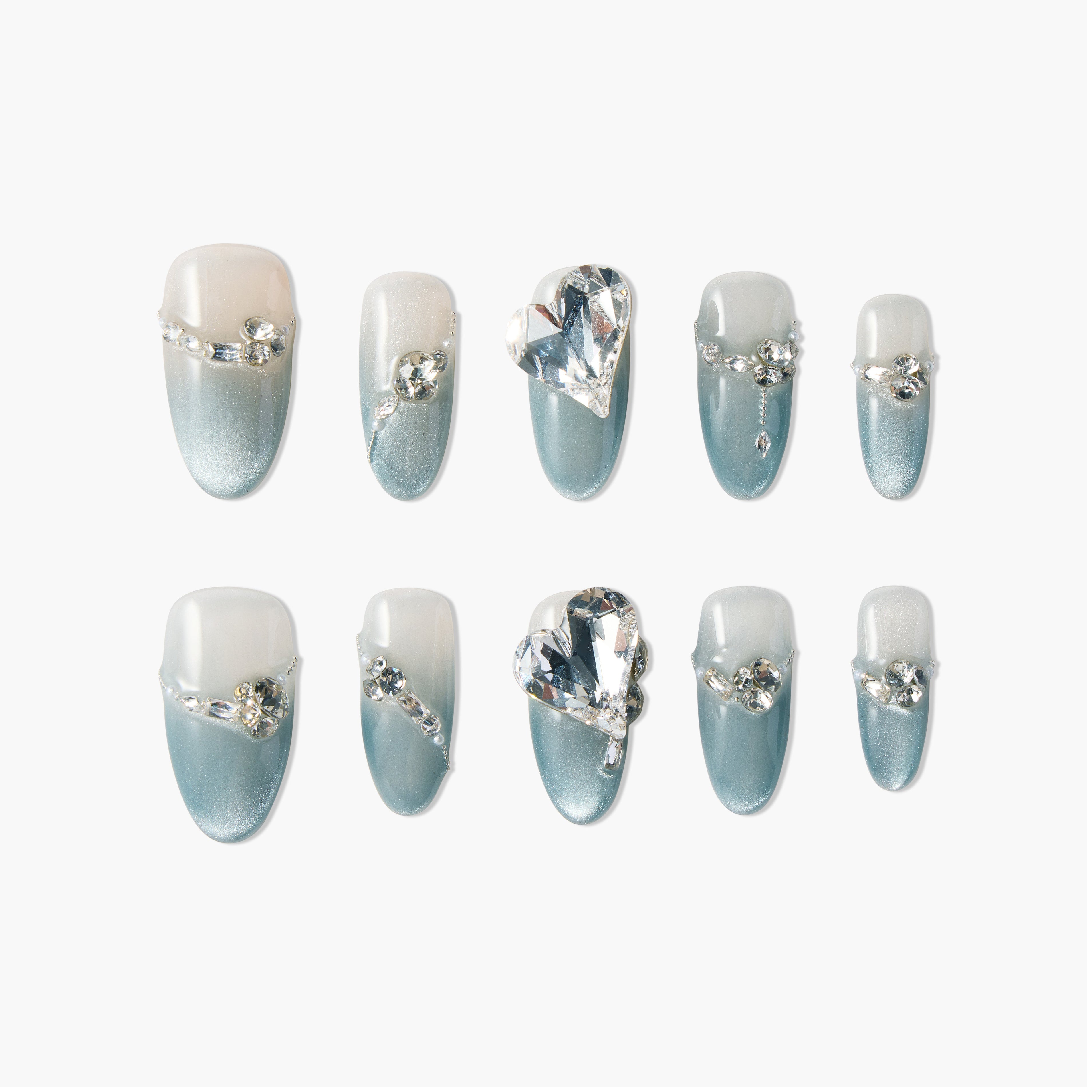Set of blue ombre press-on nails with clear rhinestones and large heart-shaped crystals