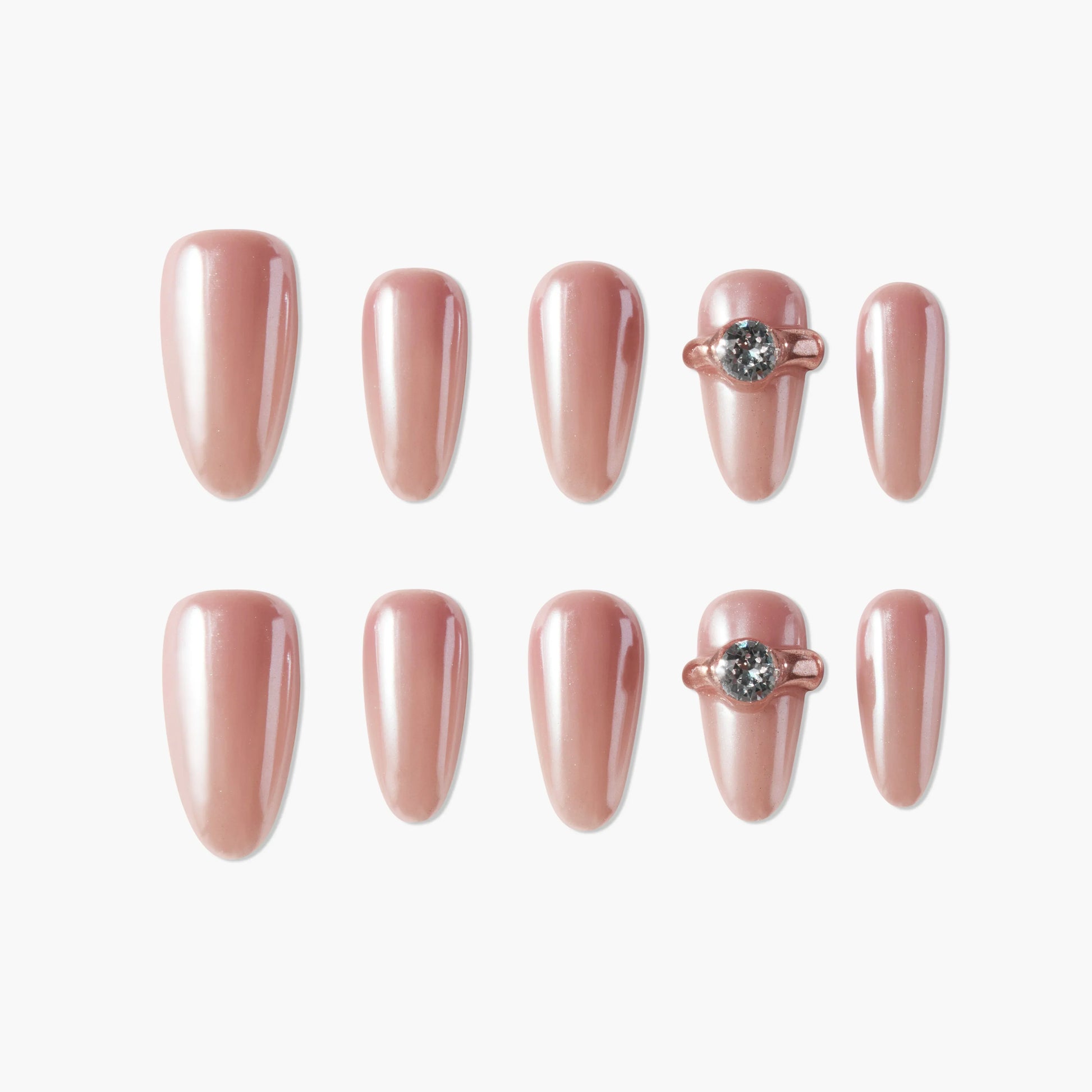 Set of glossy rose gold press-on nails with two accent nails featuring 3D gem details