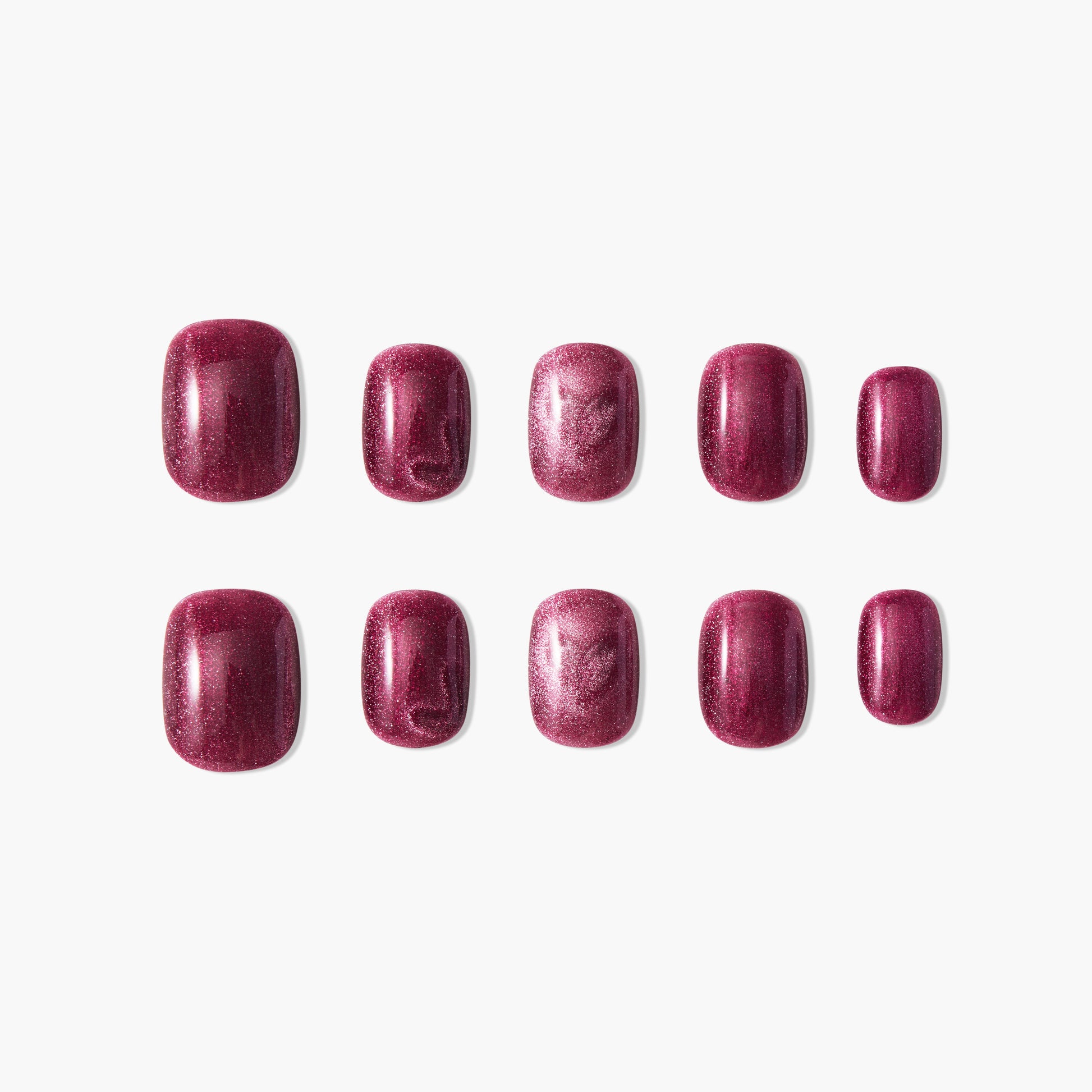 Set of glossy burgundy press-on nails with shimmer effect on a white background
