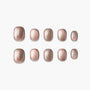 Set of glittery rose gold press-on nails with a square shape, displayed on white background.