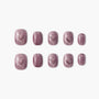 Short square press-on nails with shimmery mauve purple finish, arranged on white background.