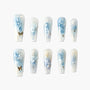 Handmade press-on nails with blue rose floral design, gold accents, and pearls