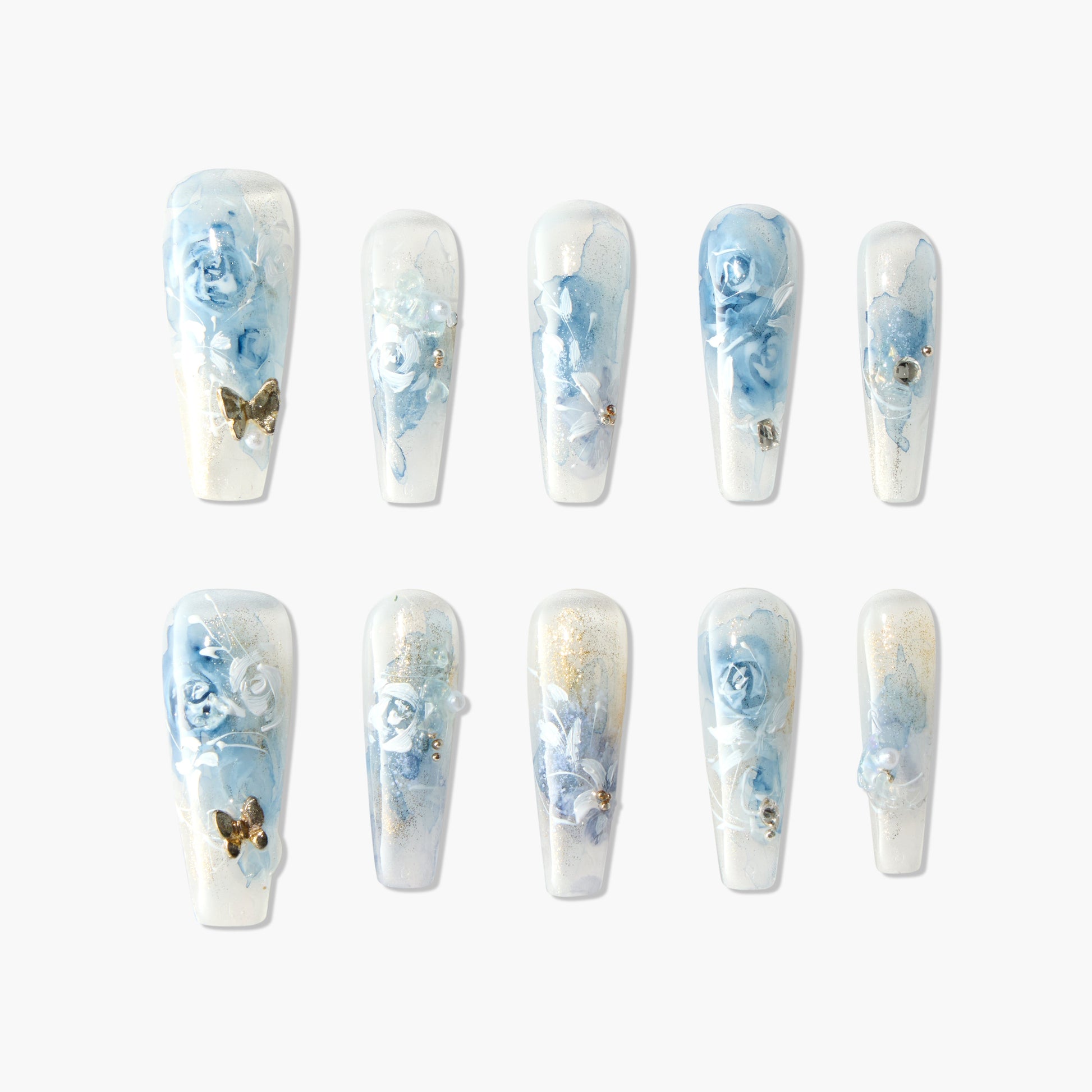 Handmade press-on nails with blue rose floral design, gold accents, and pearls