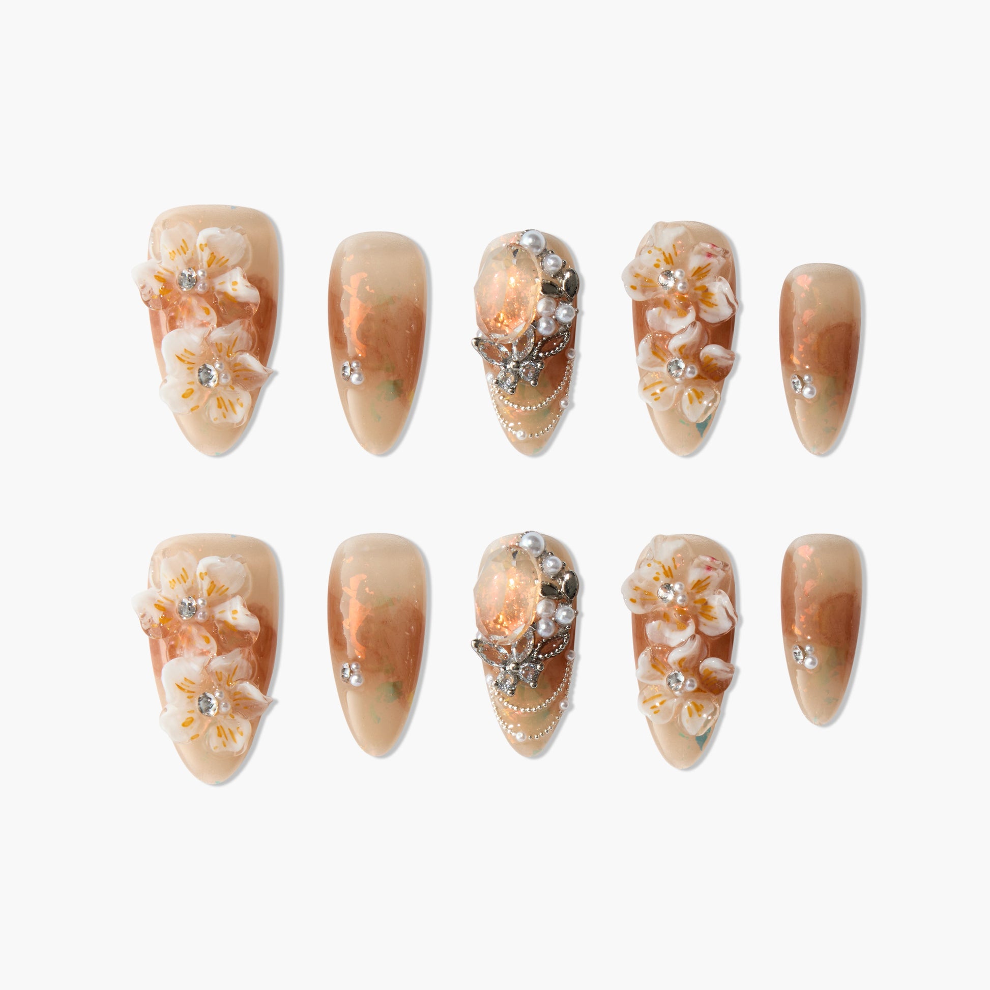 Handmade press-on nails with peach marble, floral 3D accents, rhinestones, and pearl details
