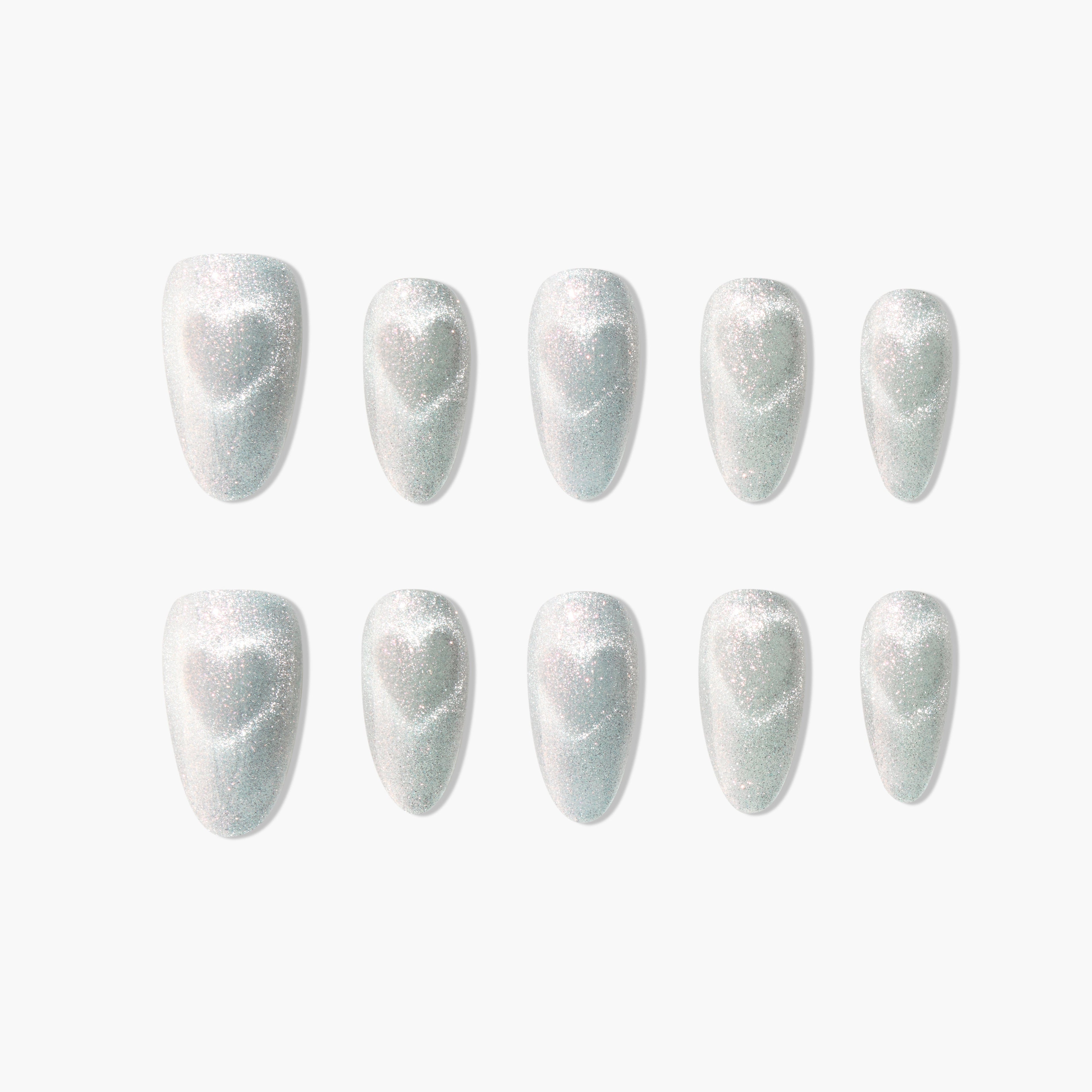Set of 10 glittery silver press-on nails with subtle heart designs on white background