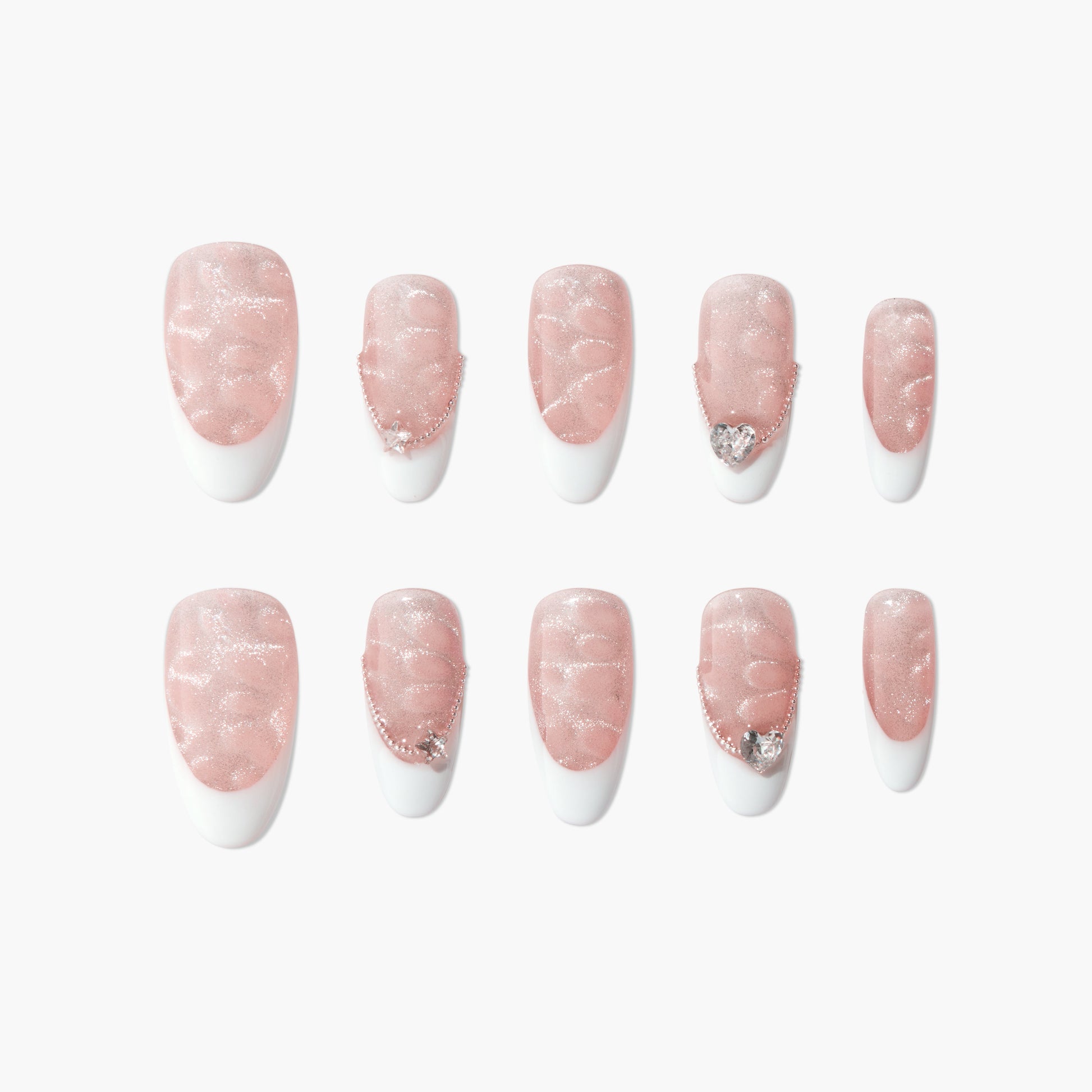Set of pink glitter press-on nails with white tips and rhinestone accents on a white background.