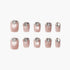 Set of 10 shimmering nude pink press-on nails with clear teardrop rhinestone accents