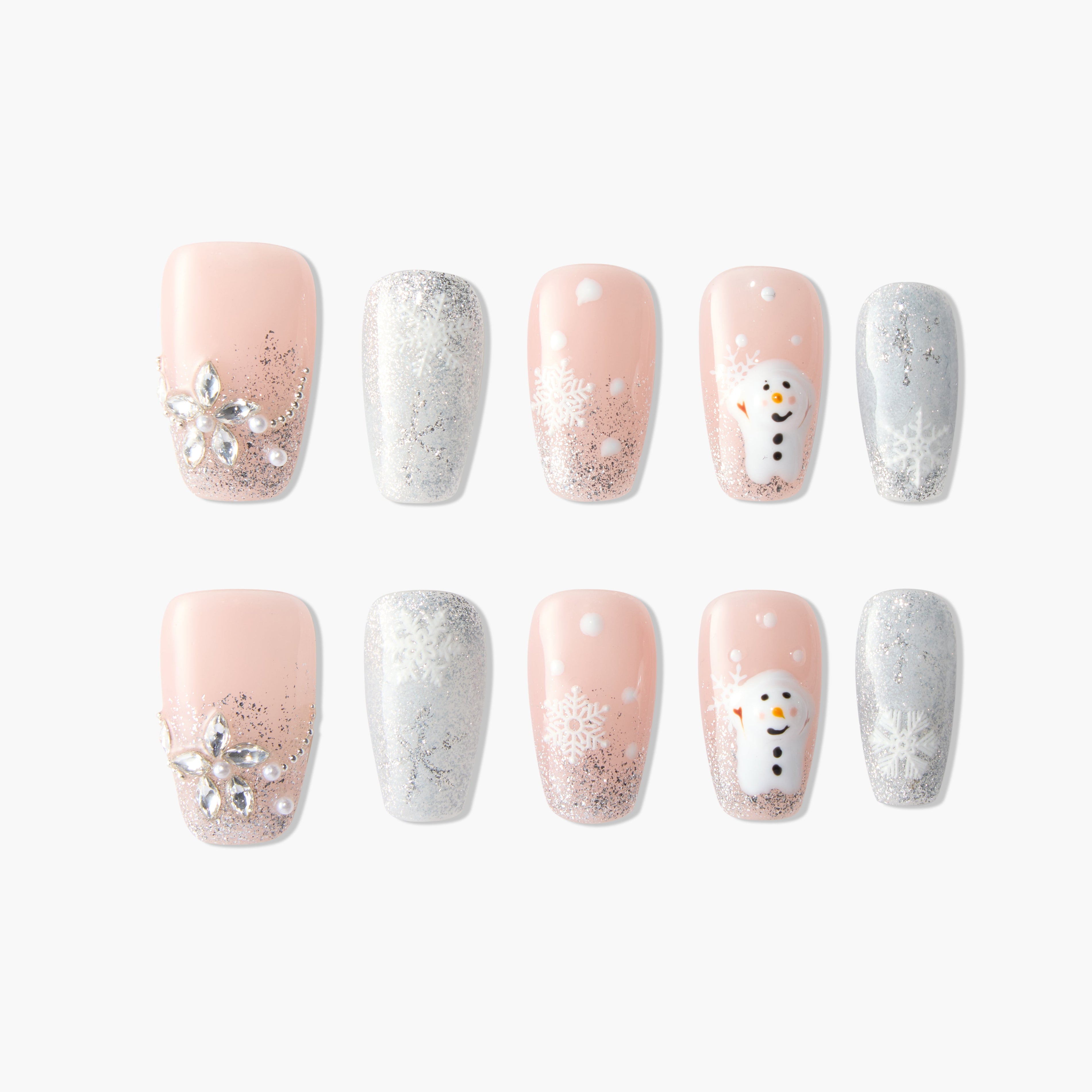 Winter-themed fake nails set with pink glitter, snowflakes, 3D snowman, and rhinestone flower accents