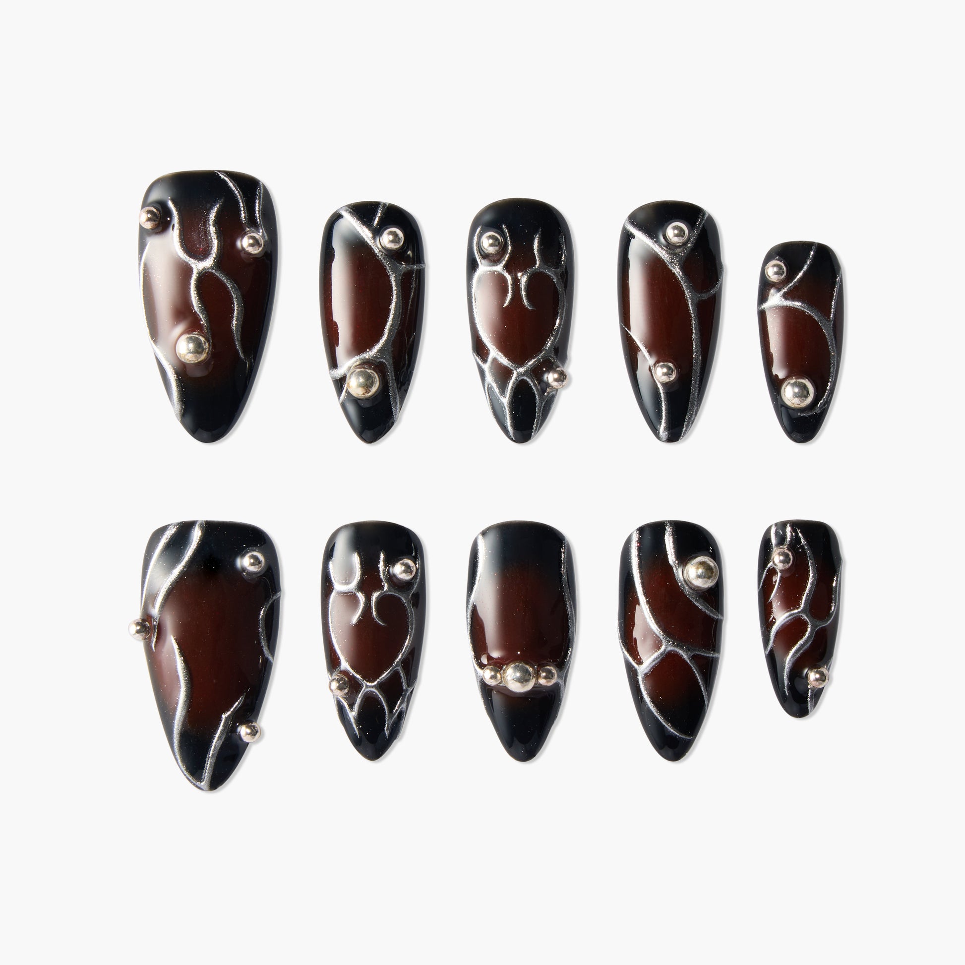 Glossy brown and black press-on nails with silver lines and 3D bead accents, set of ten