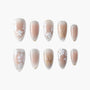 Set of elegant false nails with nude gradient base, white floral and gold leaf designs
