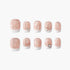 Set of 10 glittery nude and white press-on nails with star and heart rhinestone accents