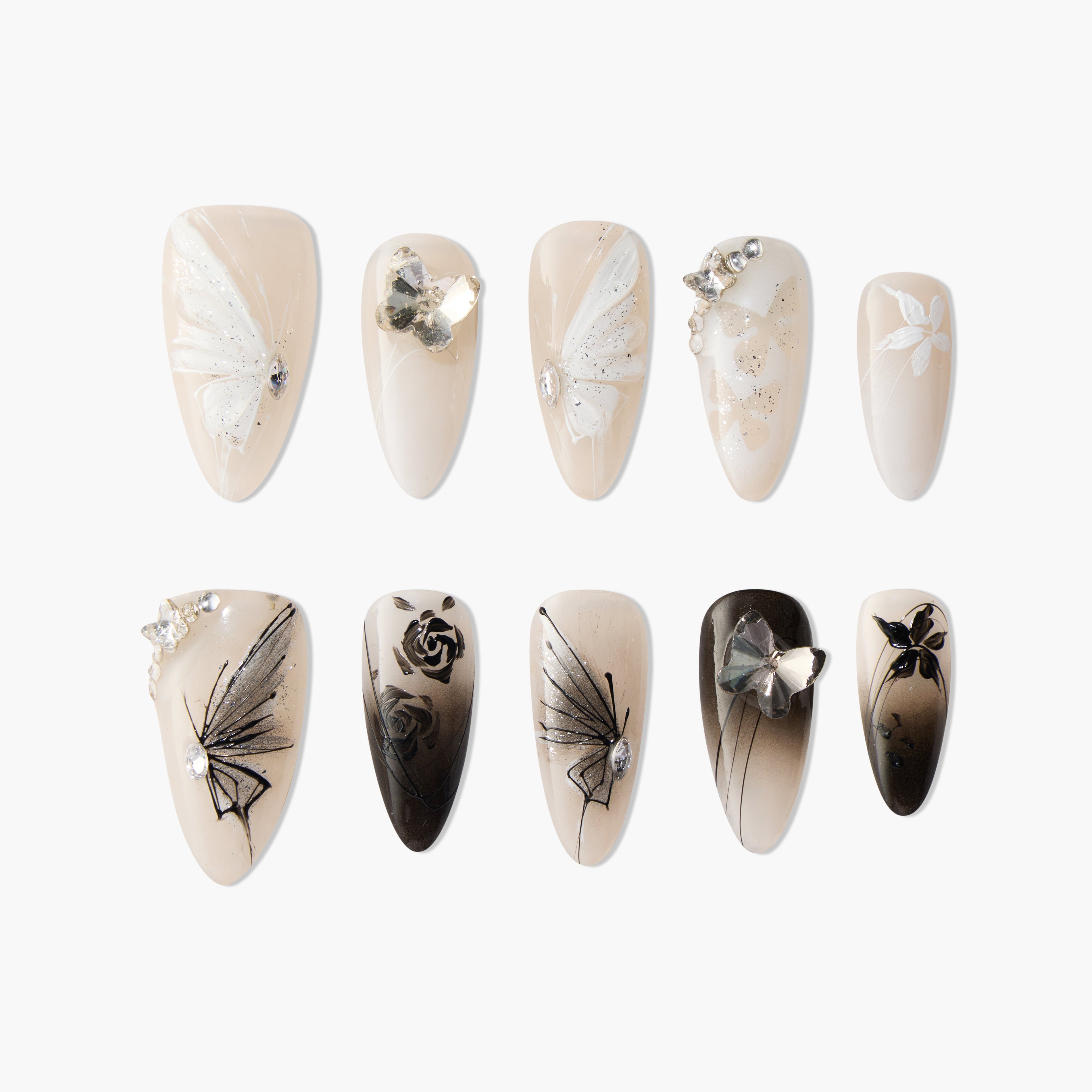 Set of elegant false nails with white and black butterfly and floral designs, adorned with crystals