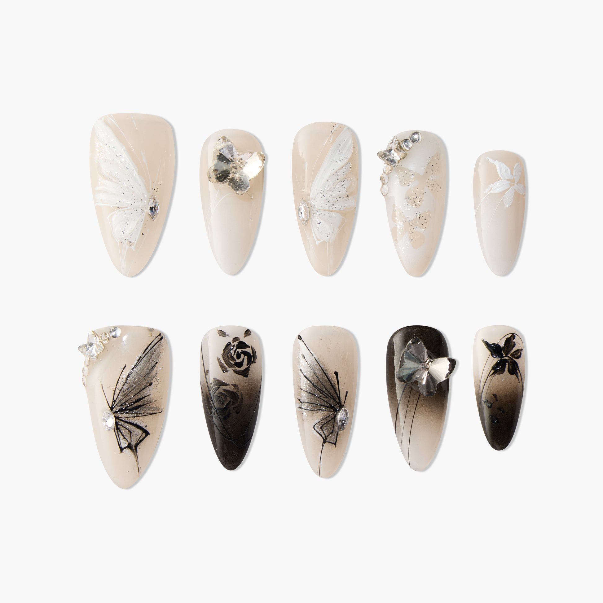 Set of elegant false nails with white and black butterfly and floral designs, adorned with crystals