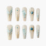 Set of 10 translucent beige and blue 3D embellished press-on nails with butterfly and gem designs