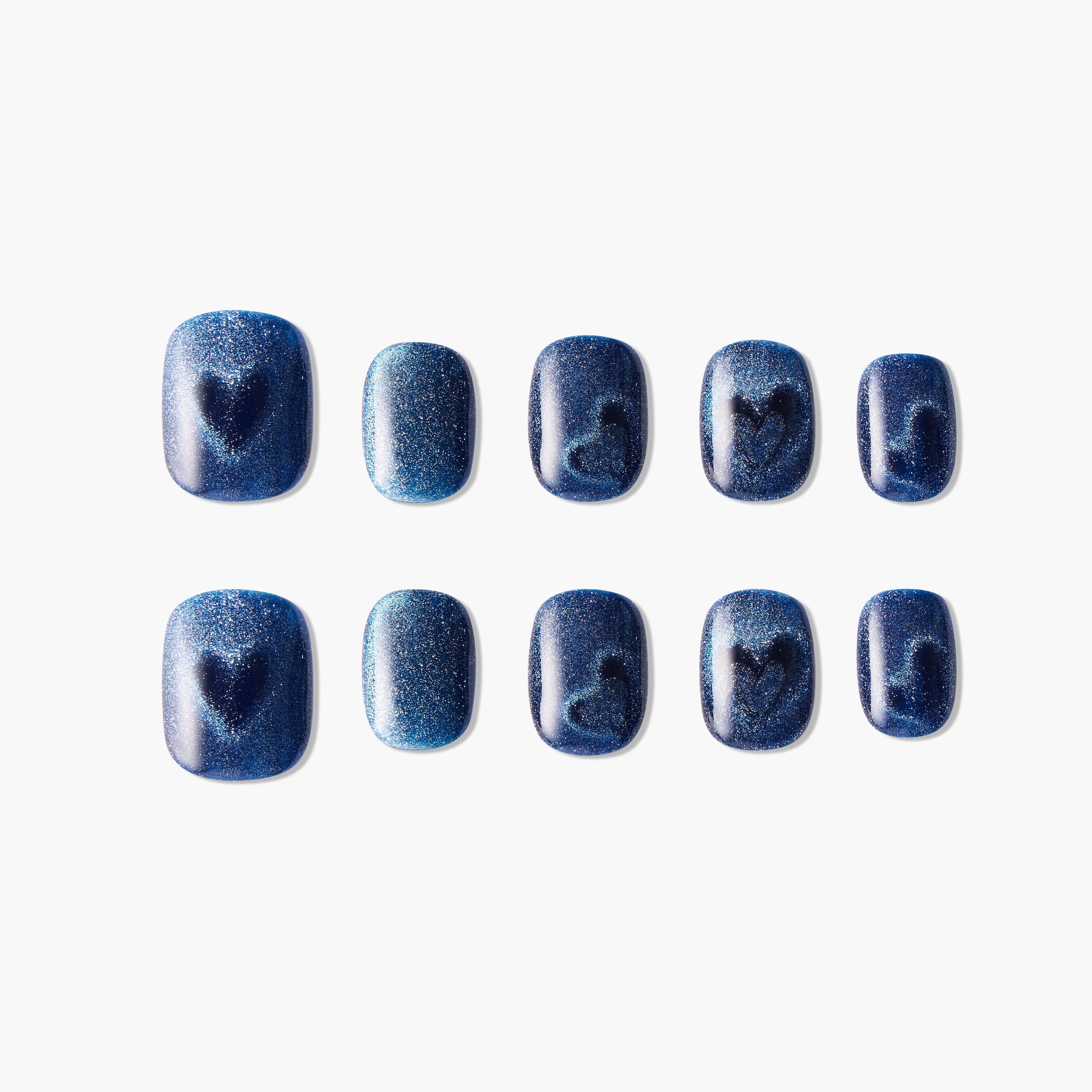Set of glossy dark blue glitter press-on nails with heart and musical note designs
