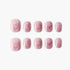 Set of pink glittery press-on nails with subtle butterfly designs, arranged on white background