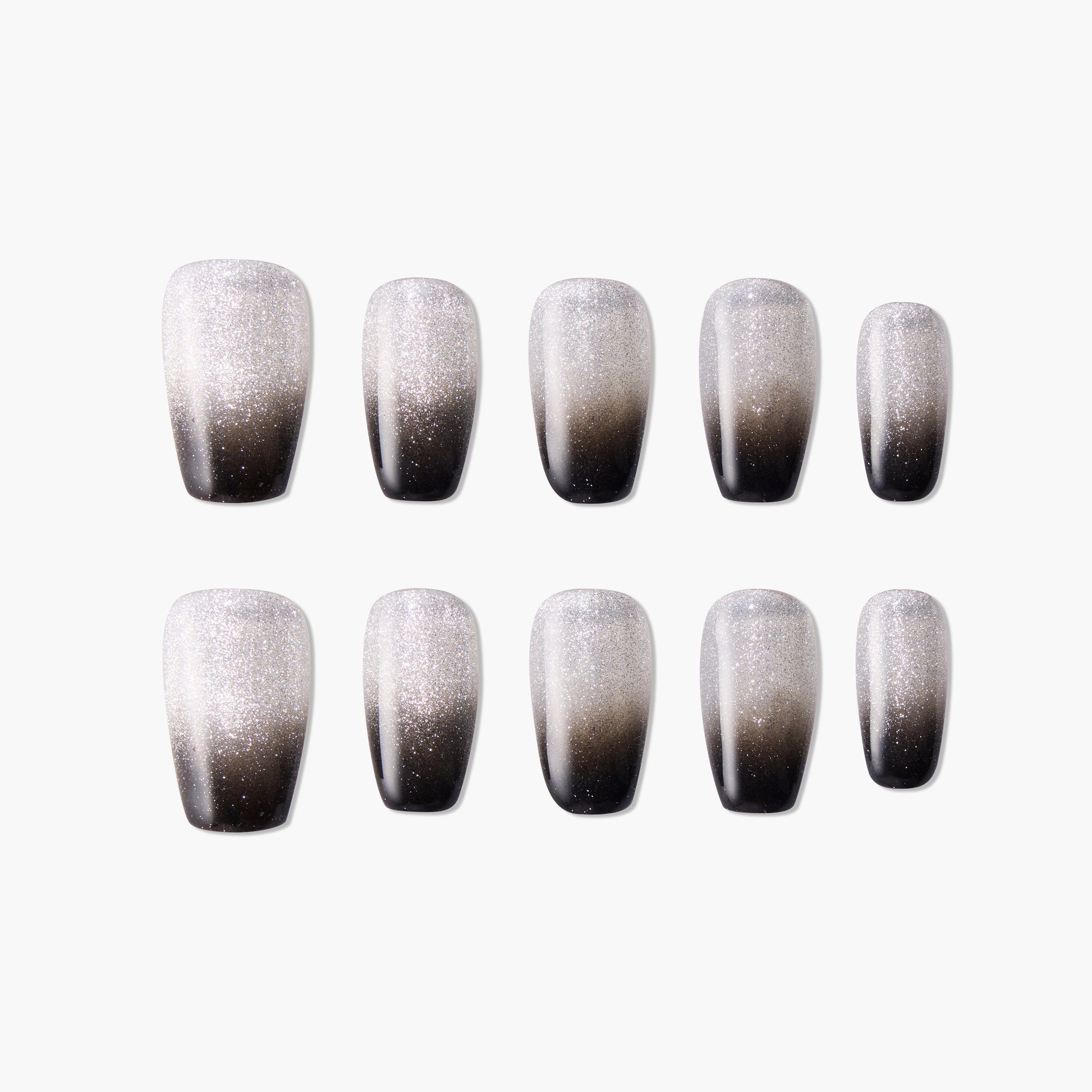 Set of black and silver ombre glitter press-on nails on a white background